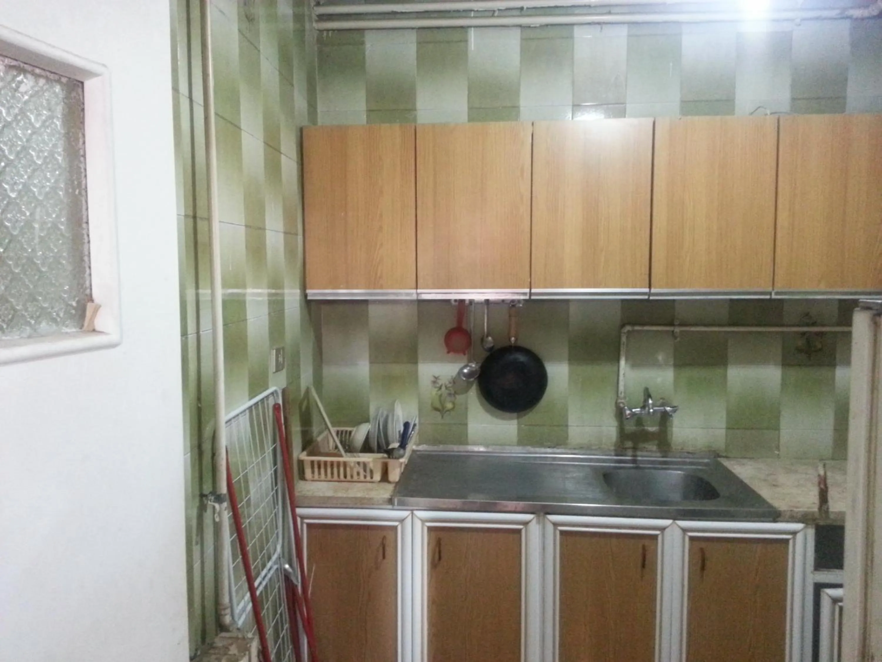 Kitchen or kitchenette in Aljazeera Hotel Apartments