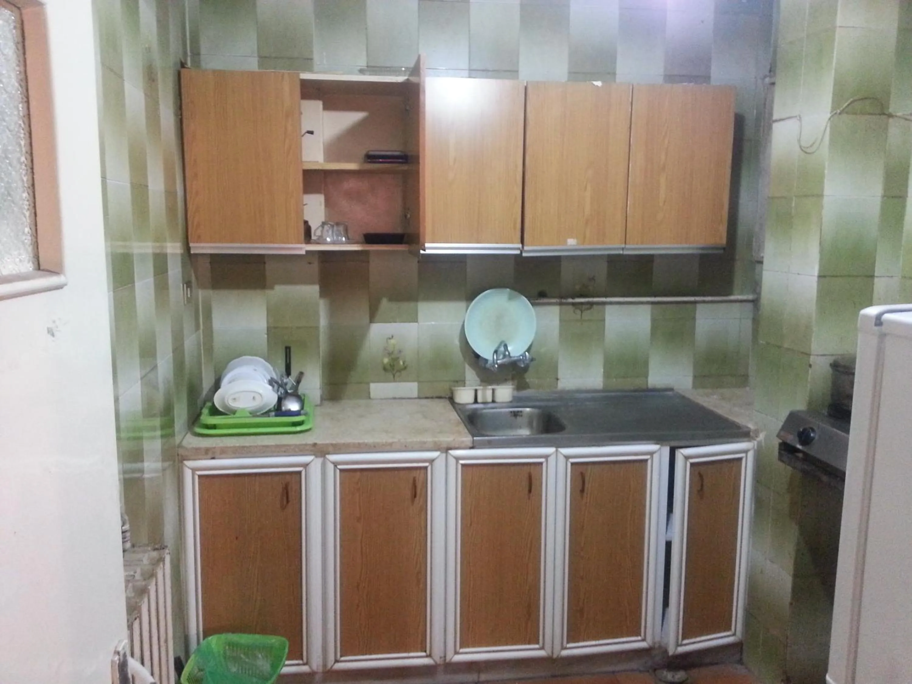 Kitchen or kitchenette in Aljazeera Hotel Apartments