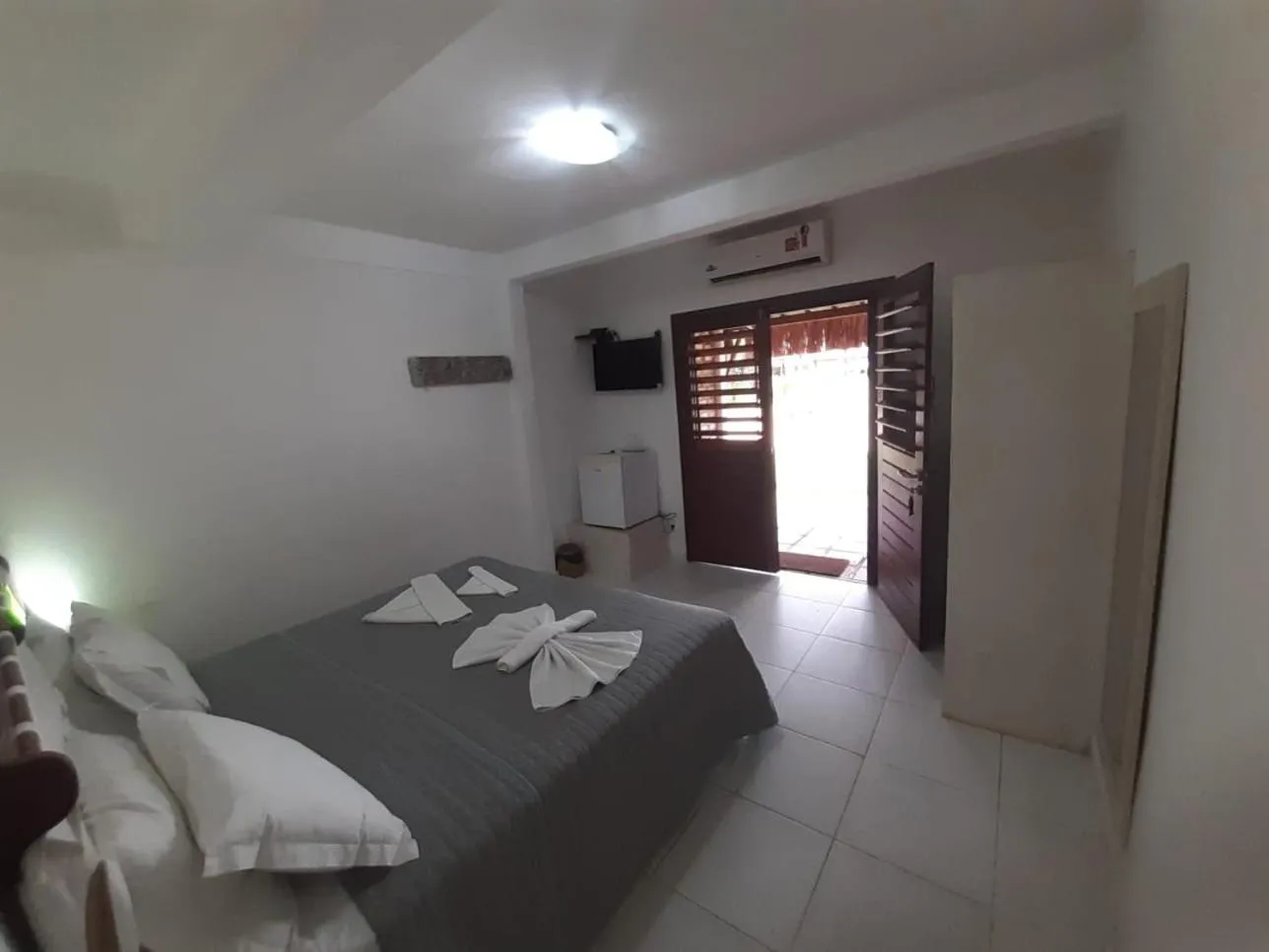 Bed in Recanto da Praia Pousada