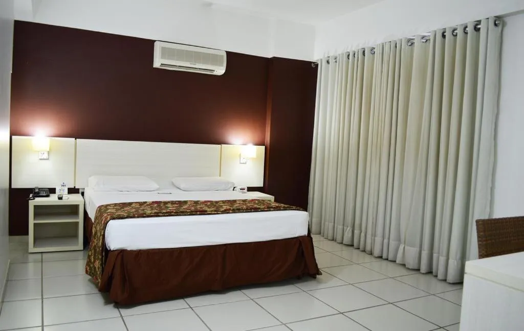 Bed in Pousada do Ipê