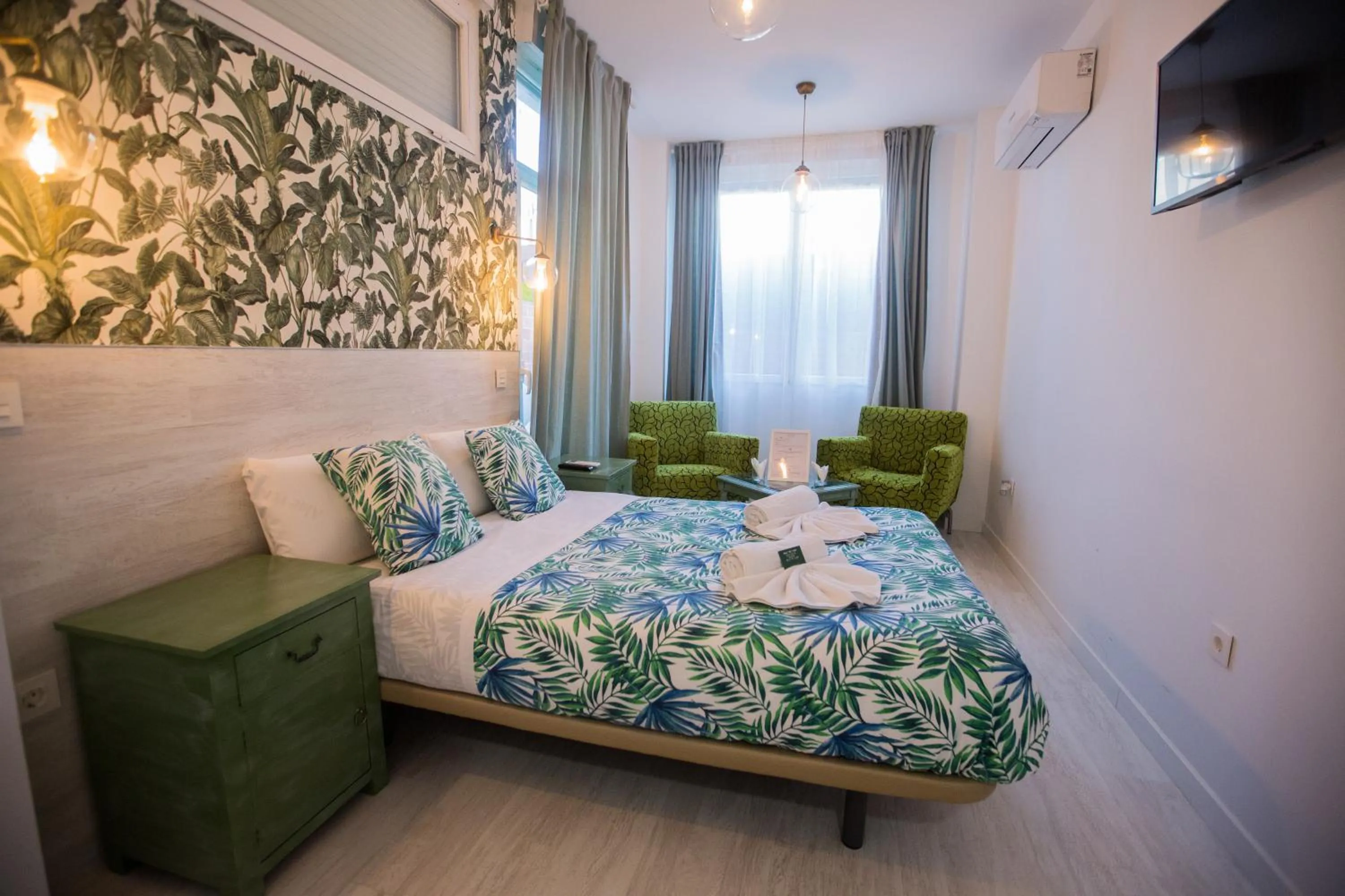 Bed in Hostal Escala Suites