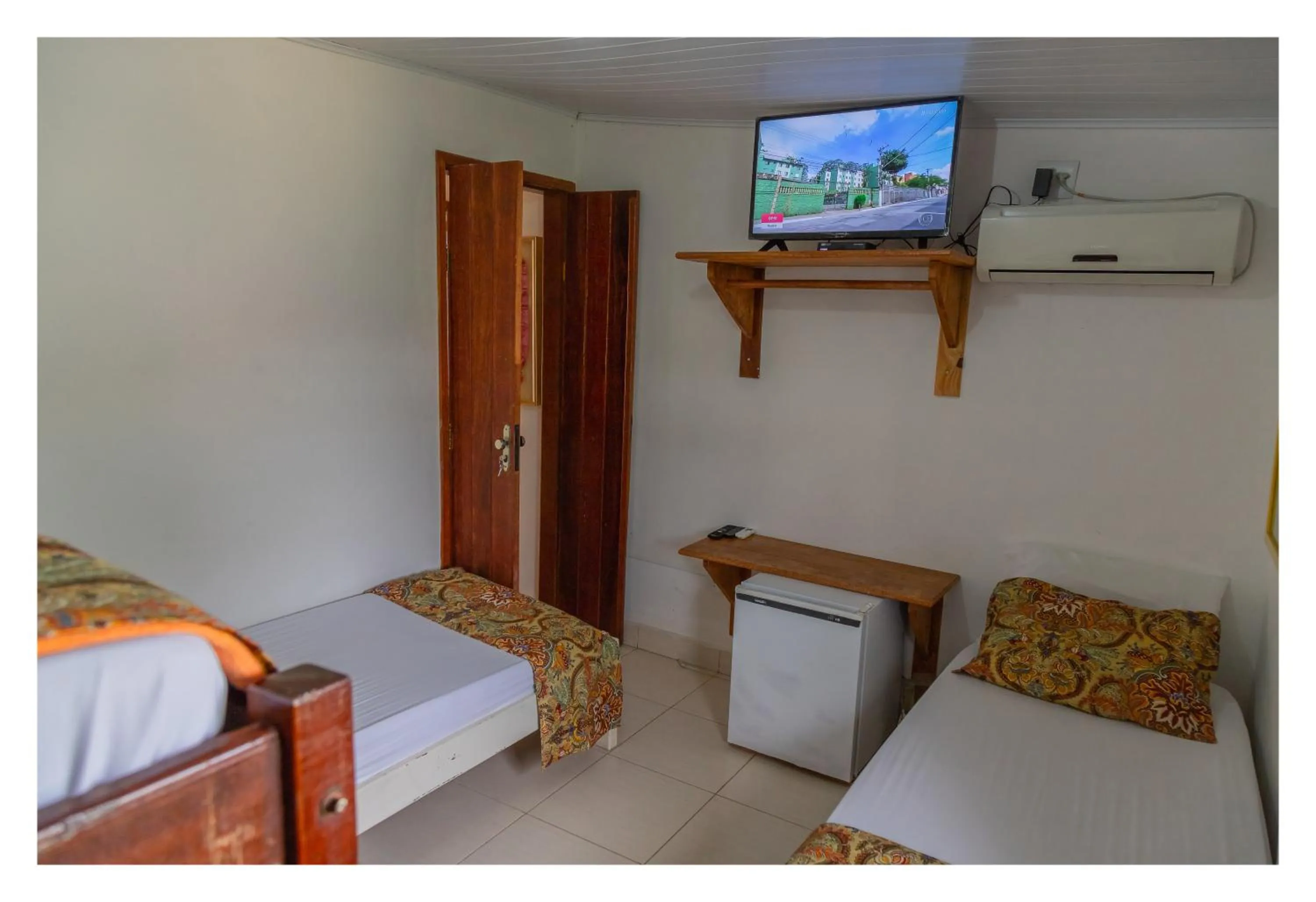 Bed in Pousada Cravo e Canela