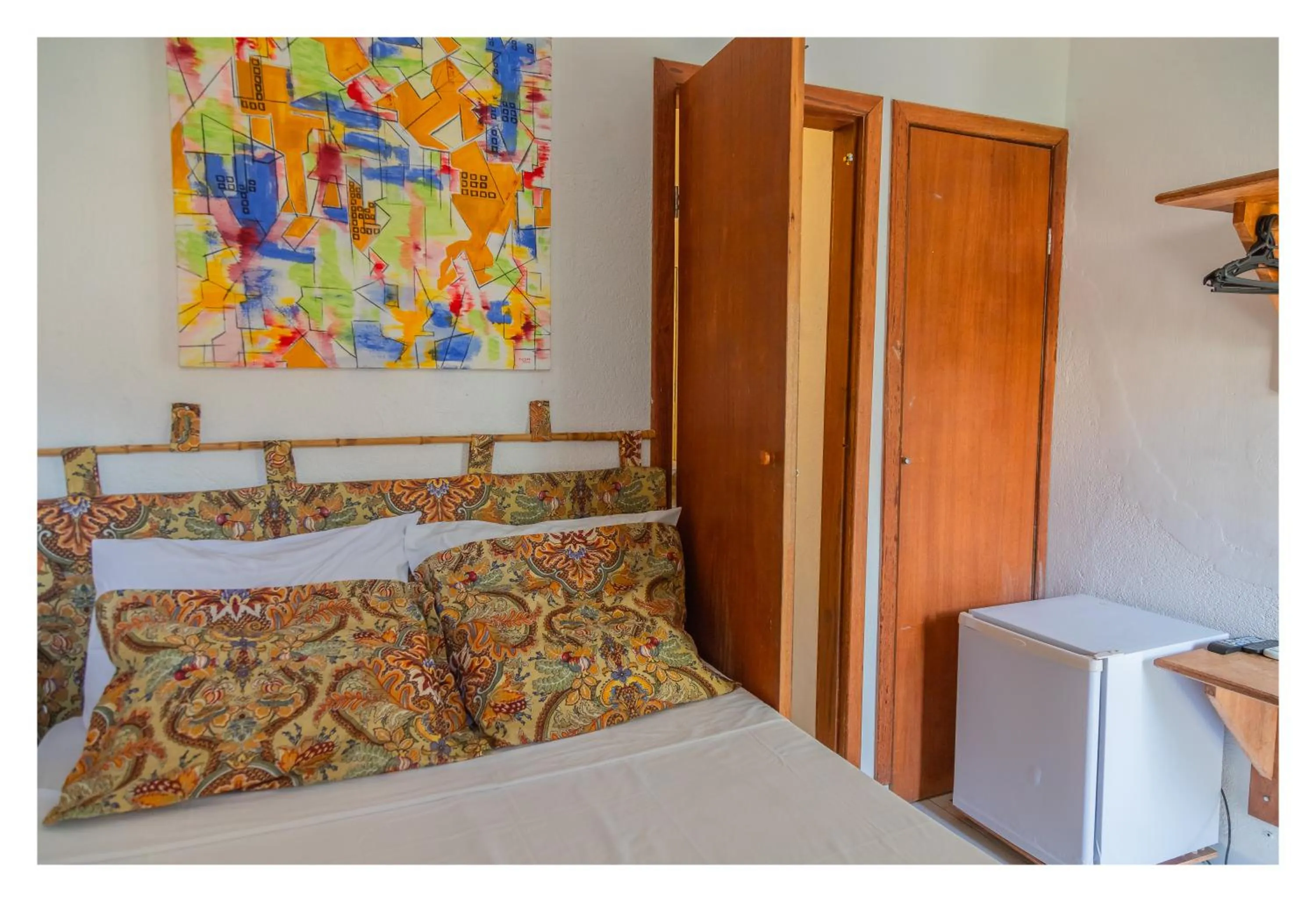 Bed in Pousada Cravo e Canela