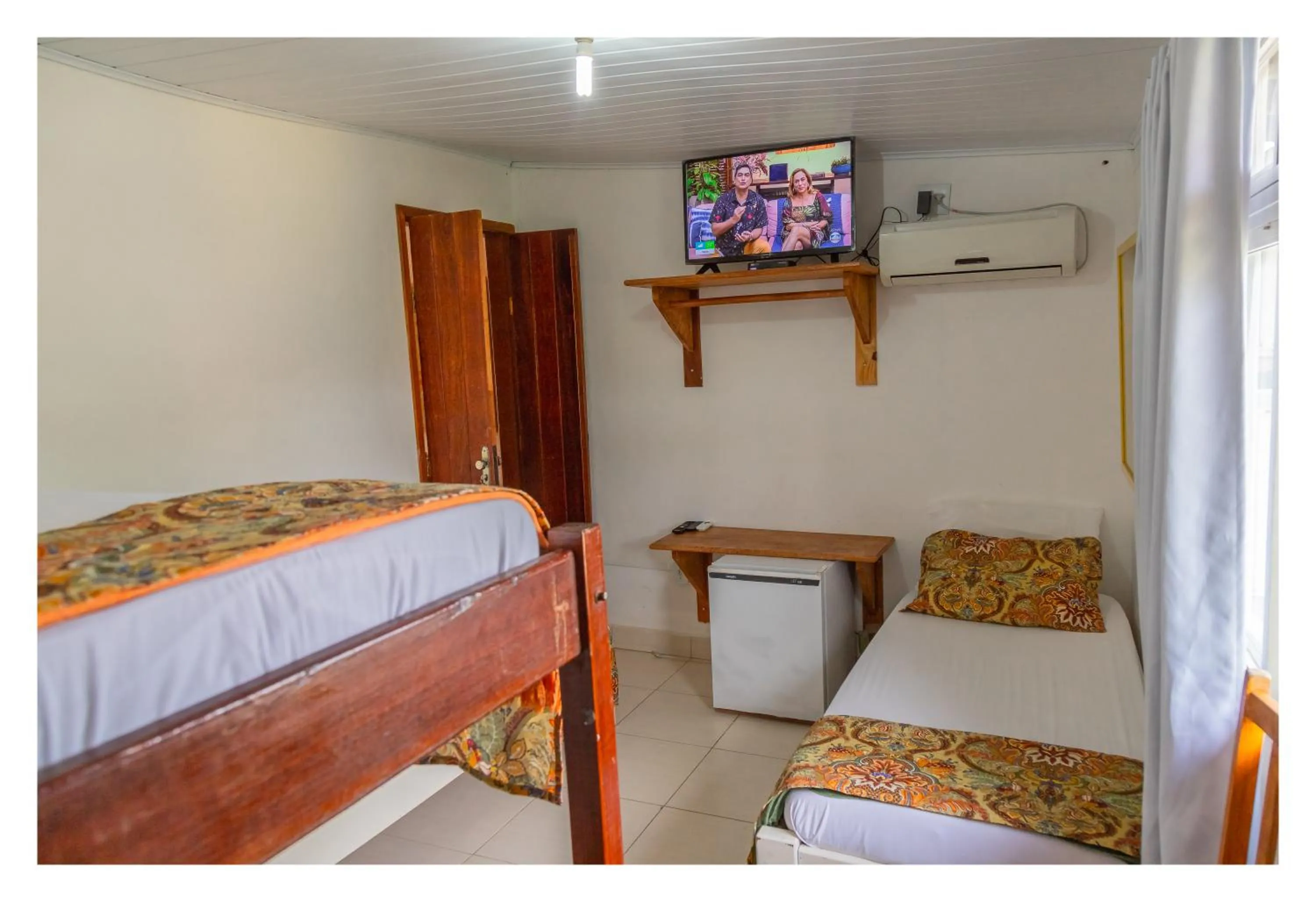 Bed in Pousada Cravo e Canela