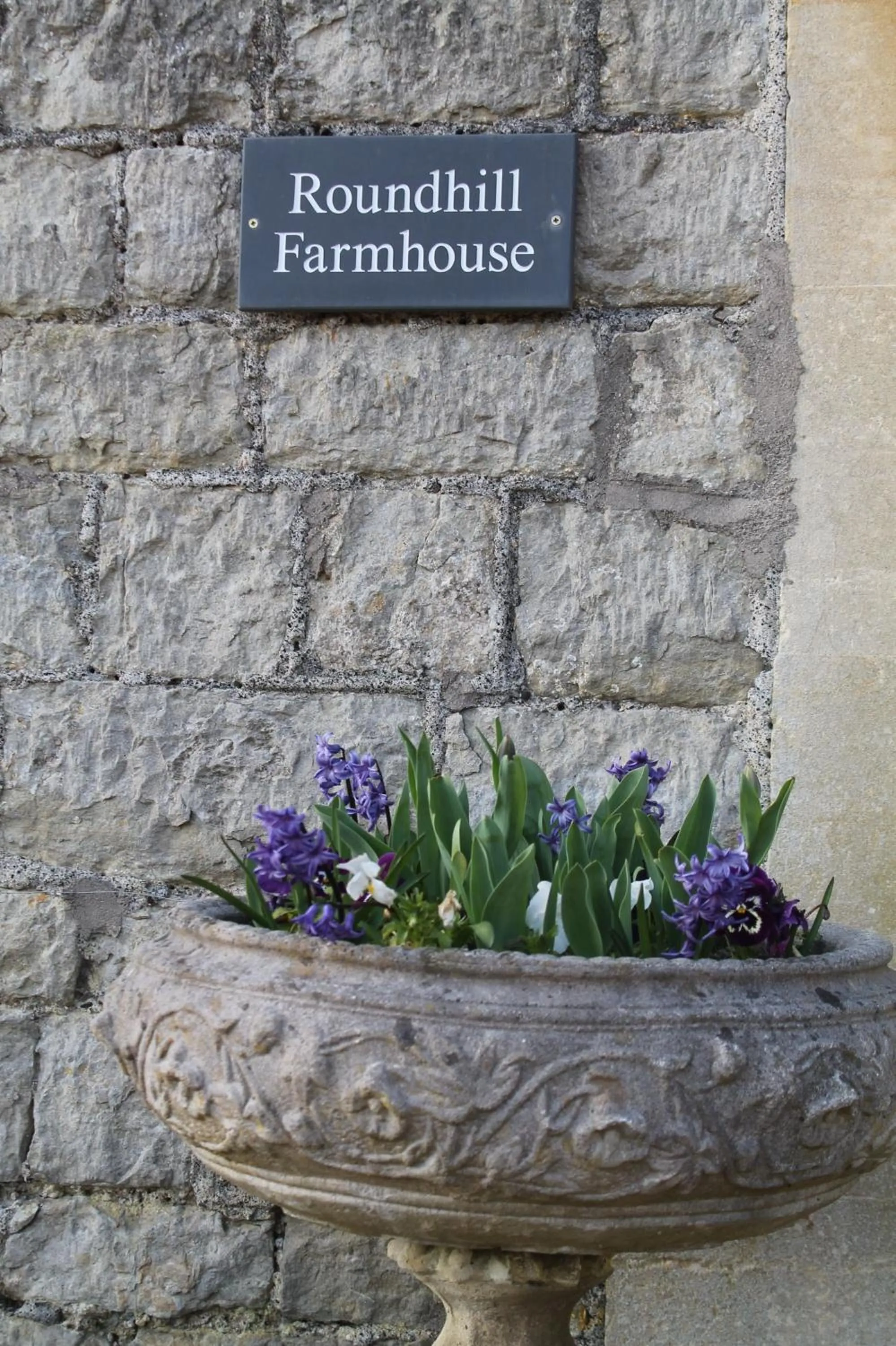 Property logo or sign in Roundhill Farmhouse