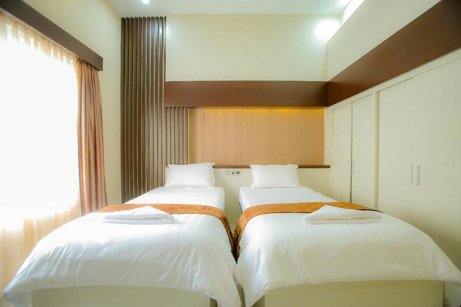 Bed in Garuda Hotel By Calandra