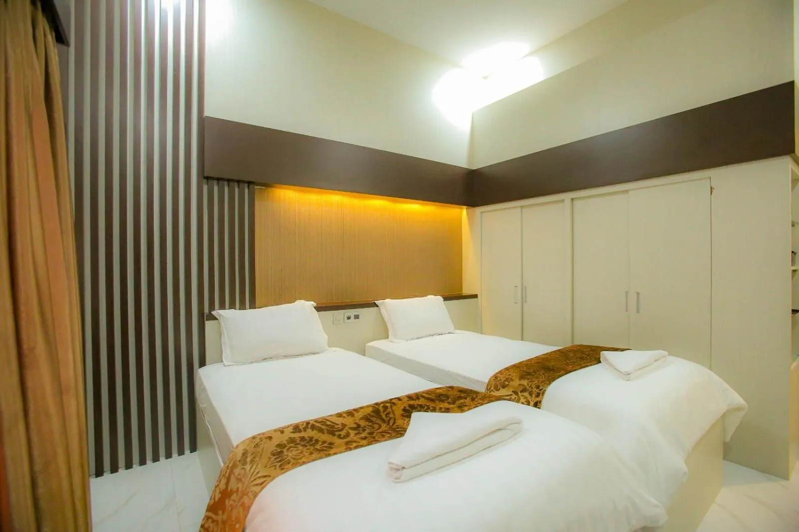 Bed in Garuda Hotel By Calandra