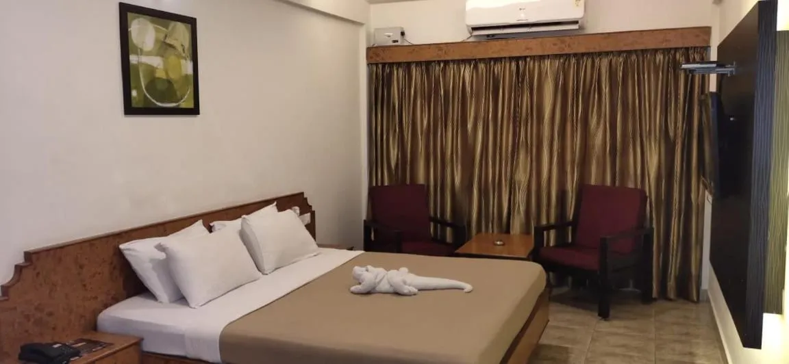 Bedroom in Hotel Sri Ram Residency