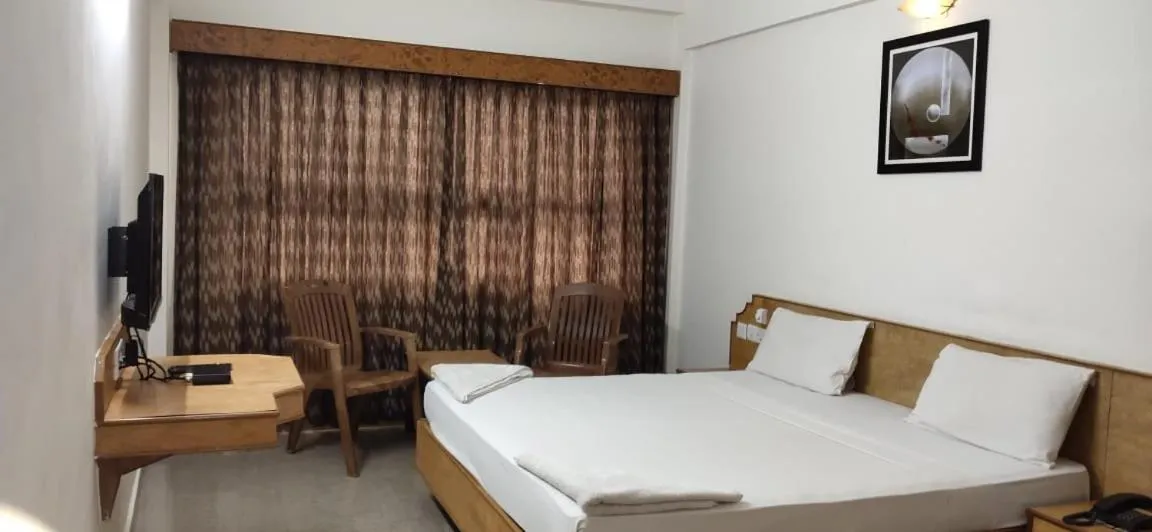 Bedroom in Hotel Sri Ram Residency