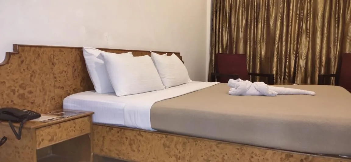 Bedroom in Hotel Sri Ram Residency