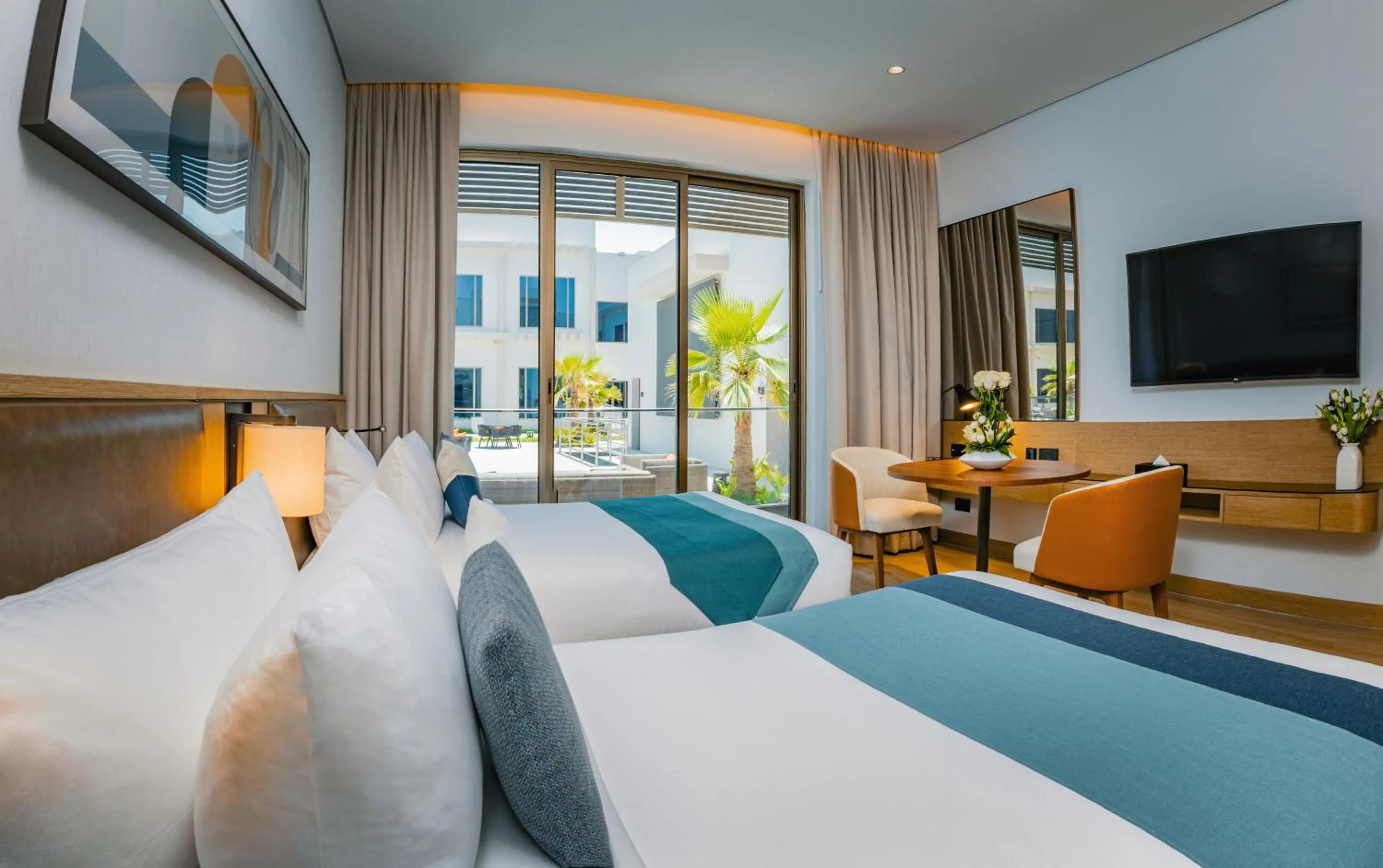 Bed in First Grand Hotel