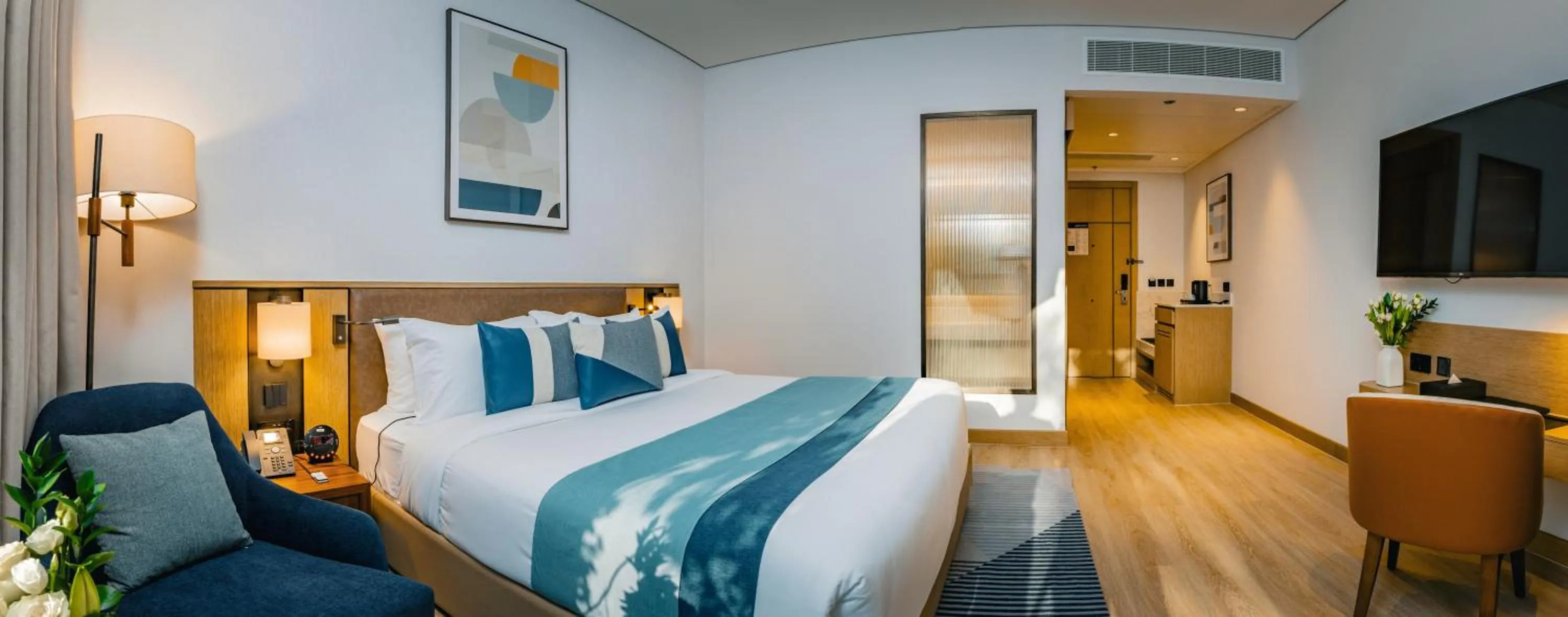 Bed in First Grand Hotel