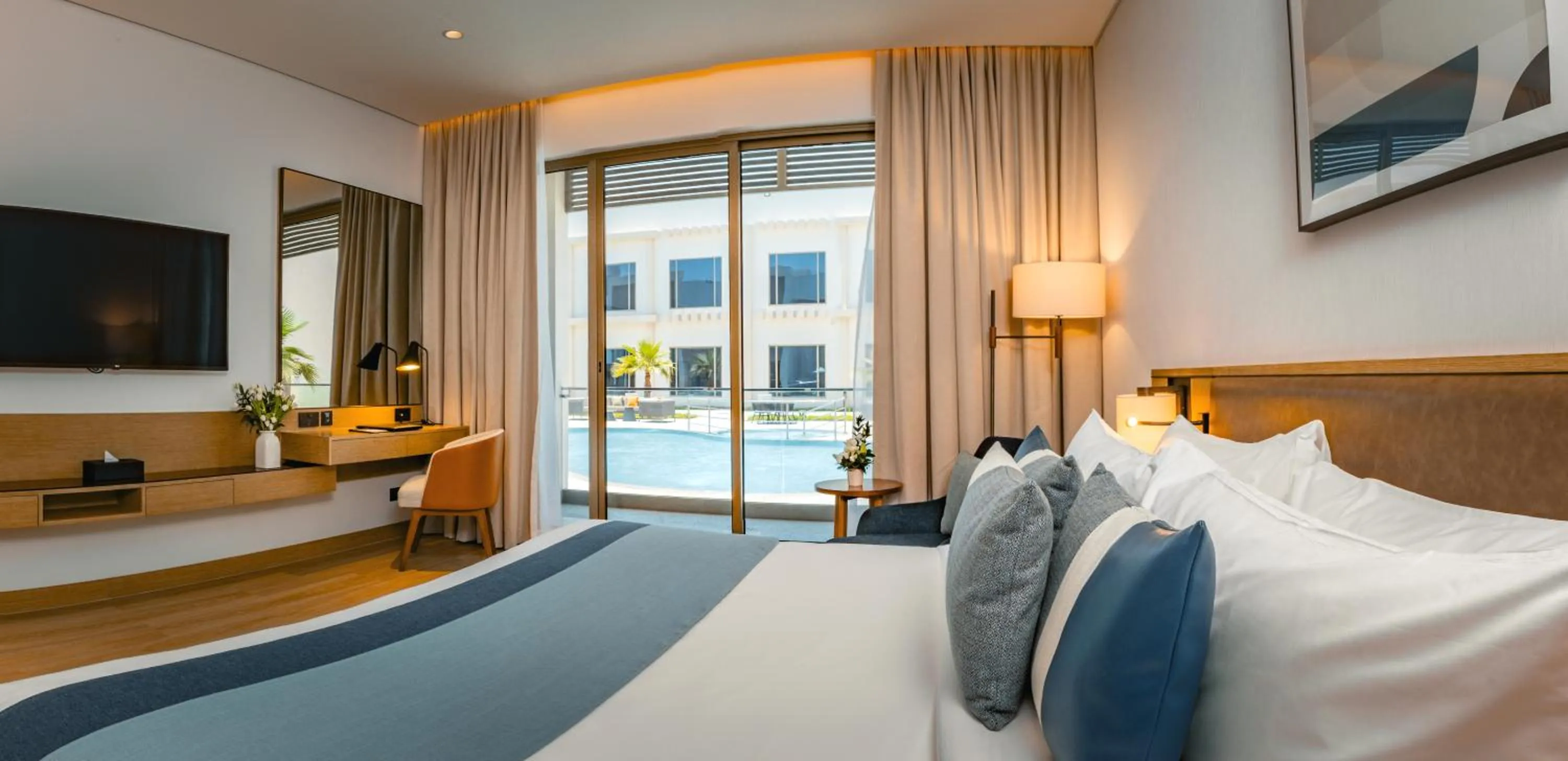 Bed in First Grand Hotel