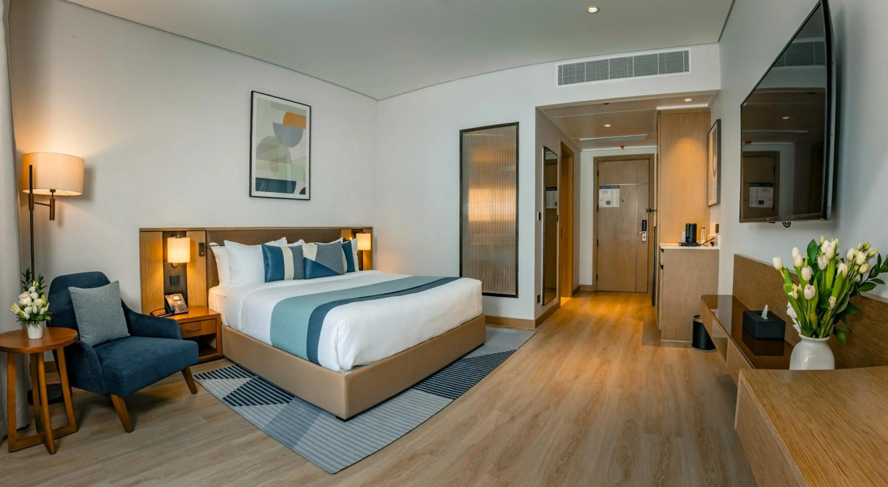 Bed in First Grand Hotel