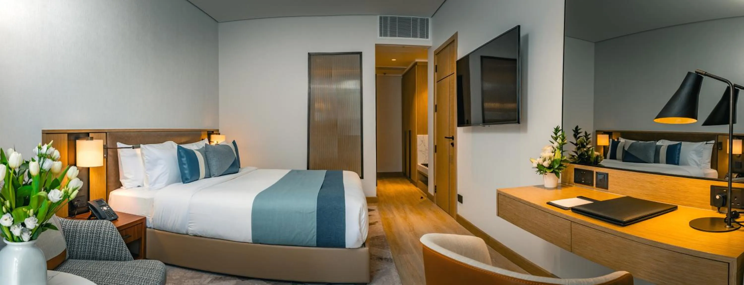 Bed in First Grand Hotel