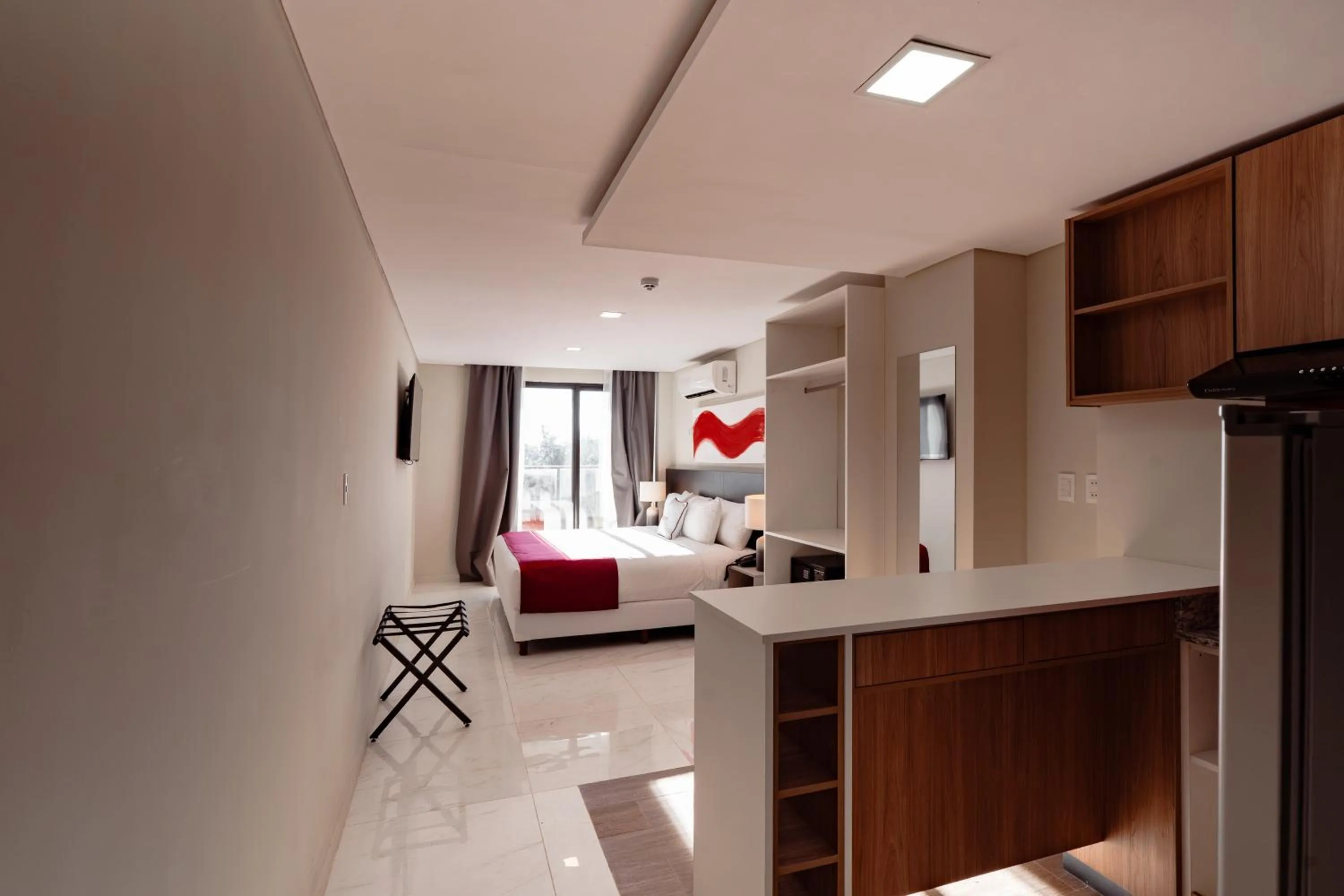 Bed in Ramada Suites by Wyndham Asuncion Aeropuerto