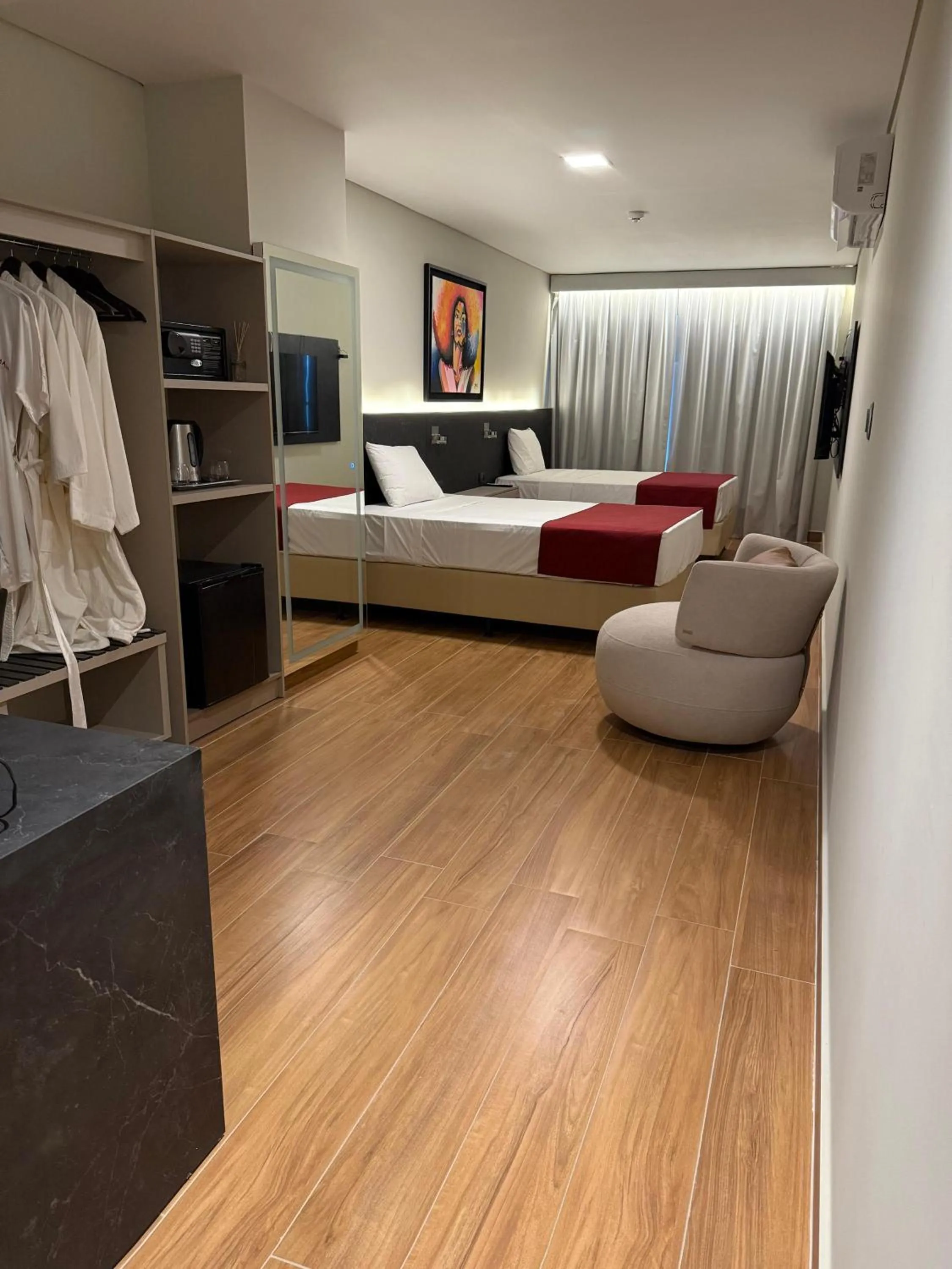 Bed in Ramada Suites by Wyndham Asuncion Aeropuerto