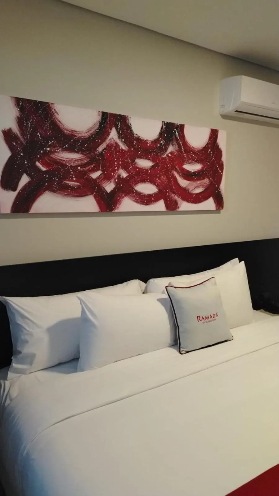 Bed in Ramada Suites by Wyndham Asuncion Aeropuerto