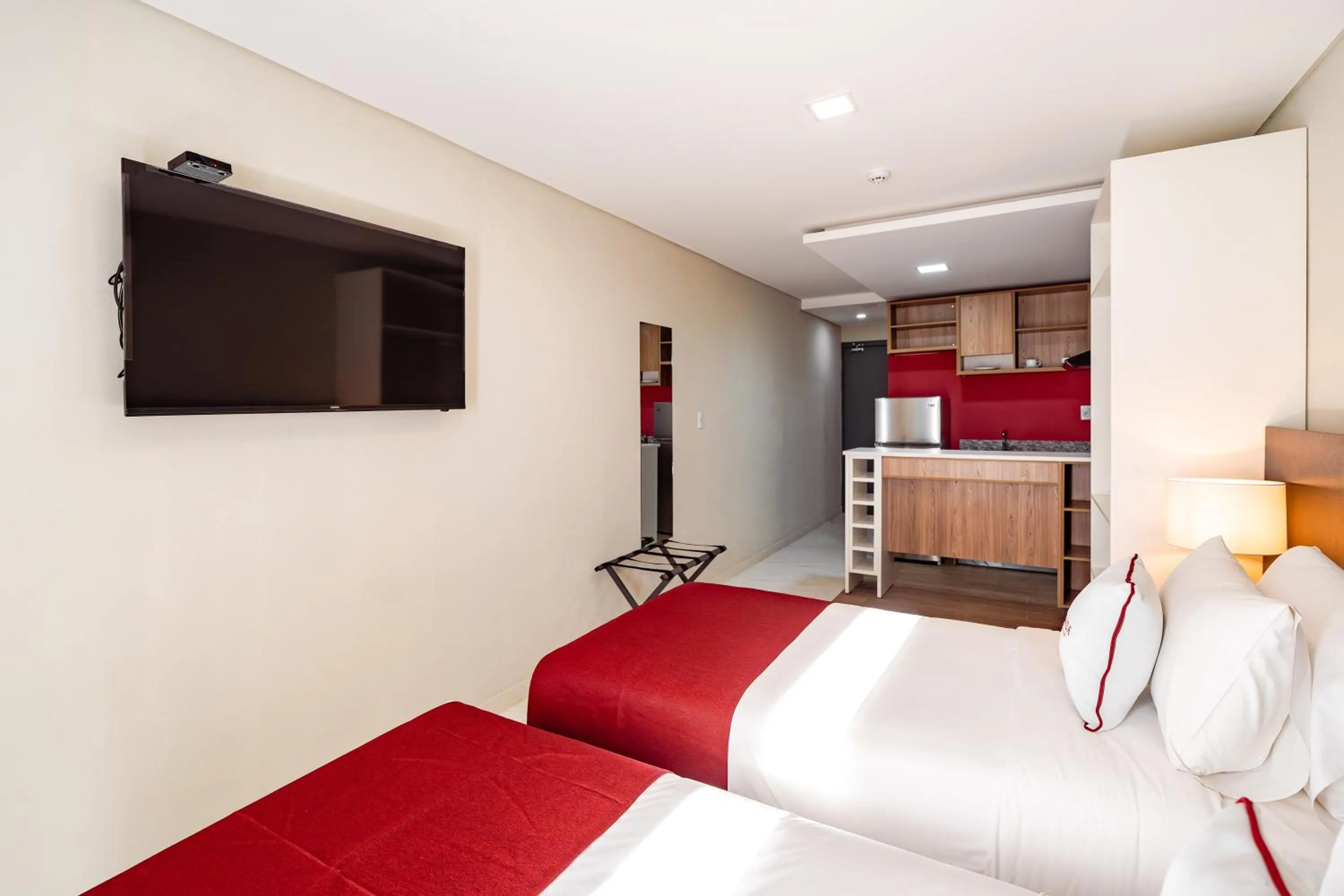 Bed in Ramada Suites by Wyndham Asuncion Aeropuerto