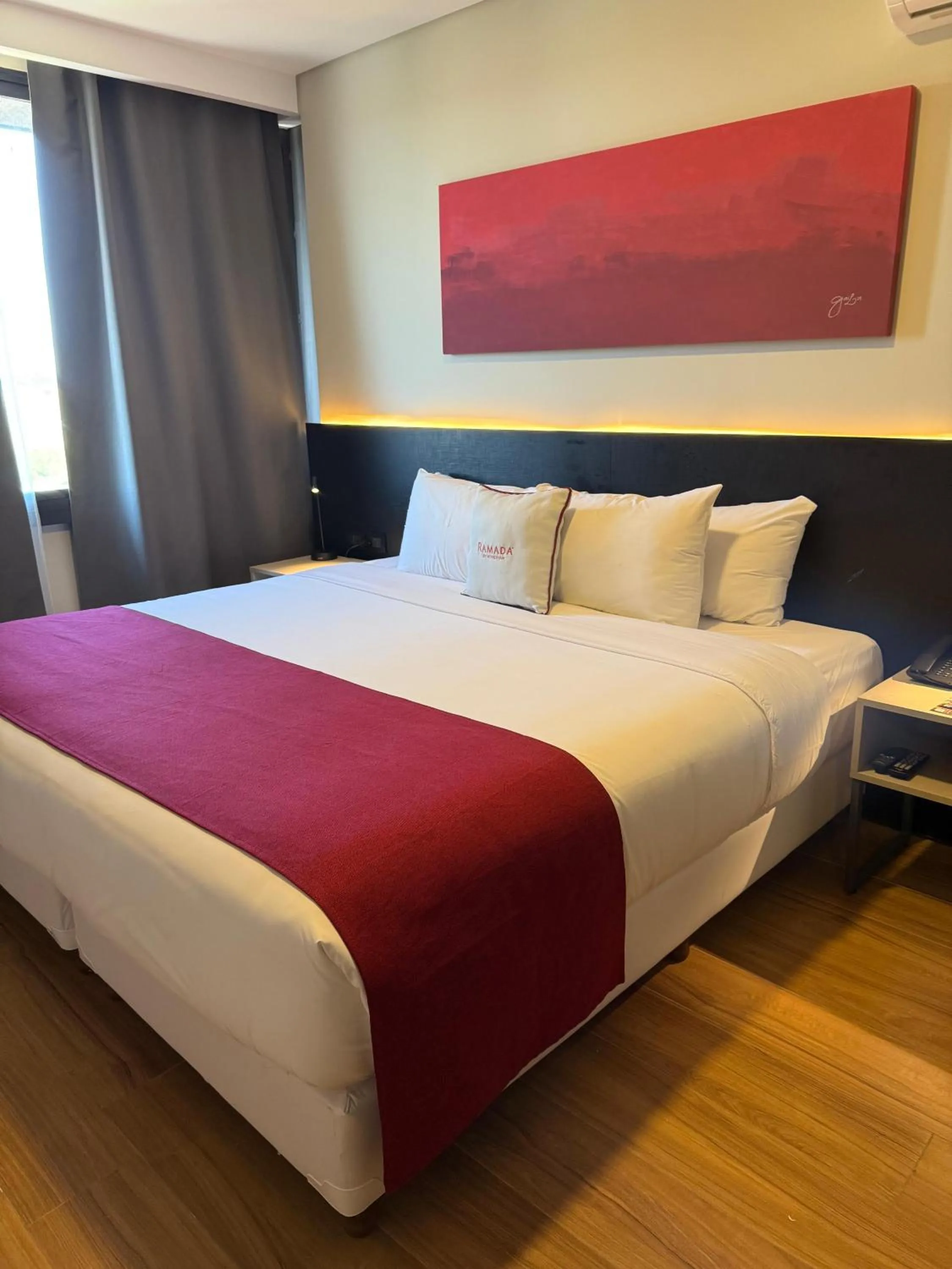 Bed in Ramada Suites by Wyndham Asuncion Aeropuerto