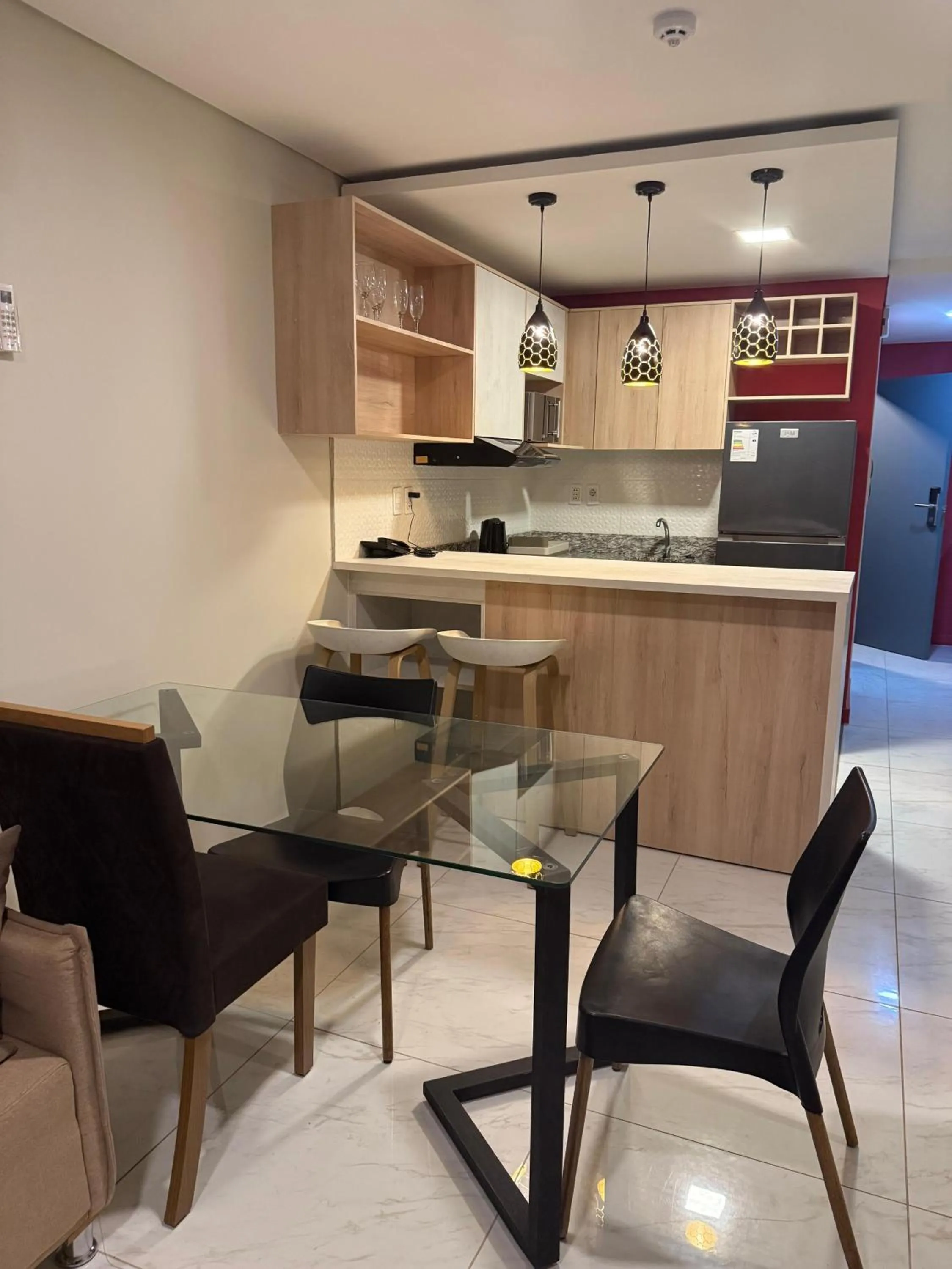 Kitchen or kitchenette in Ramada Suites by Wyndham Asuncion Aeropuerto
