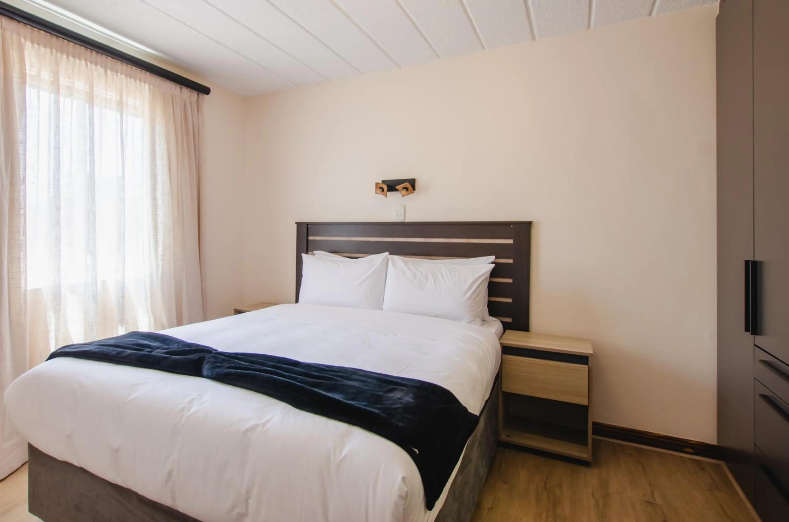 Bed in Melrose Corner Self-Catering Hotel Apartments