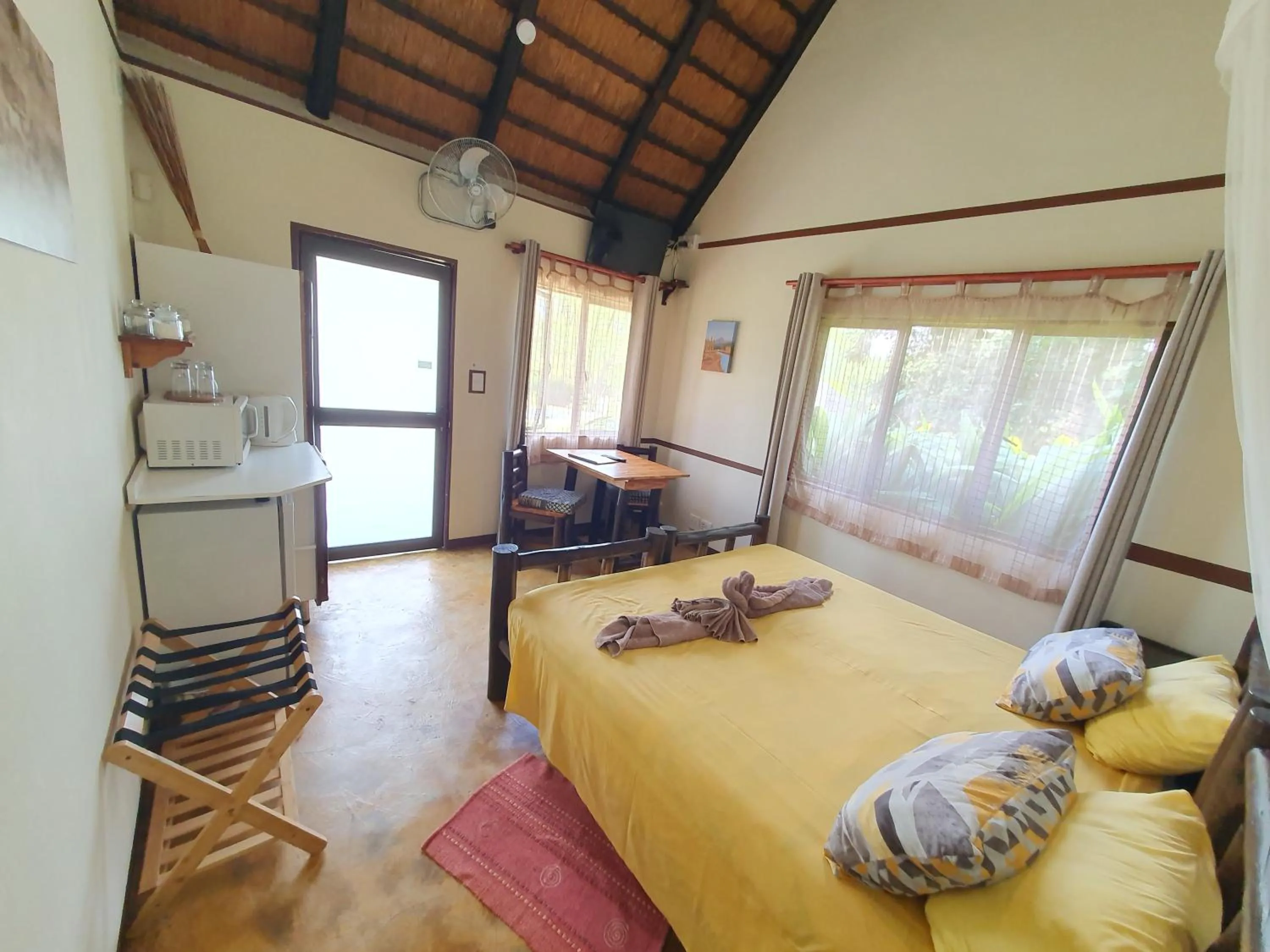 Photo of the whole room, Bed in Thokozani Lodge