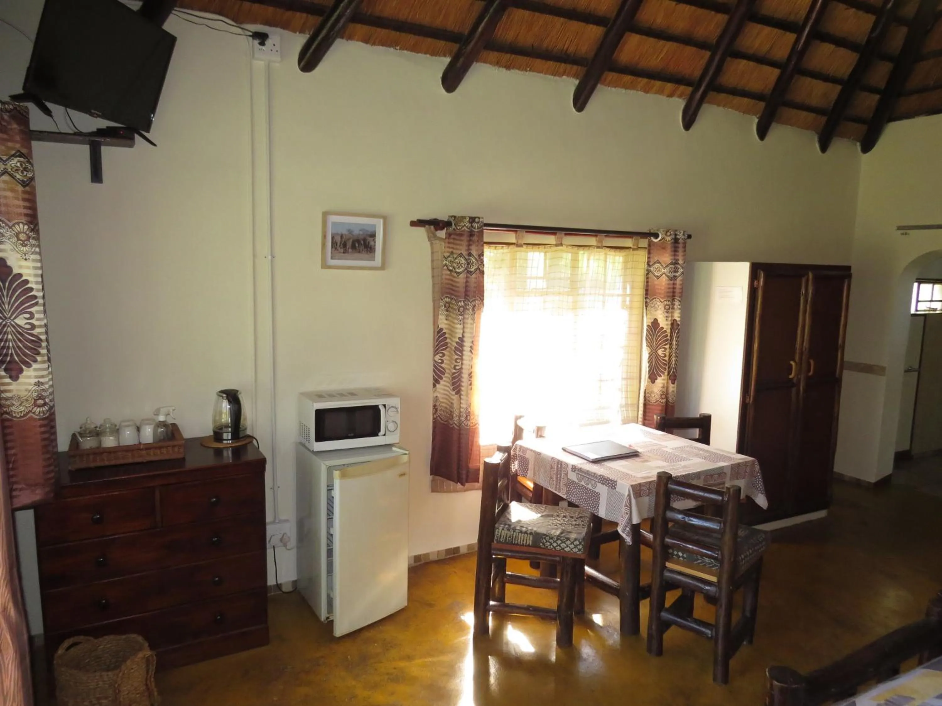 Photo of the whole room, Bed in Thokozani Lodge