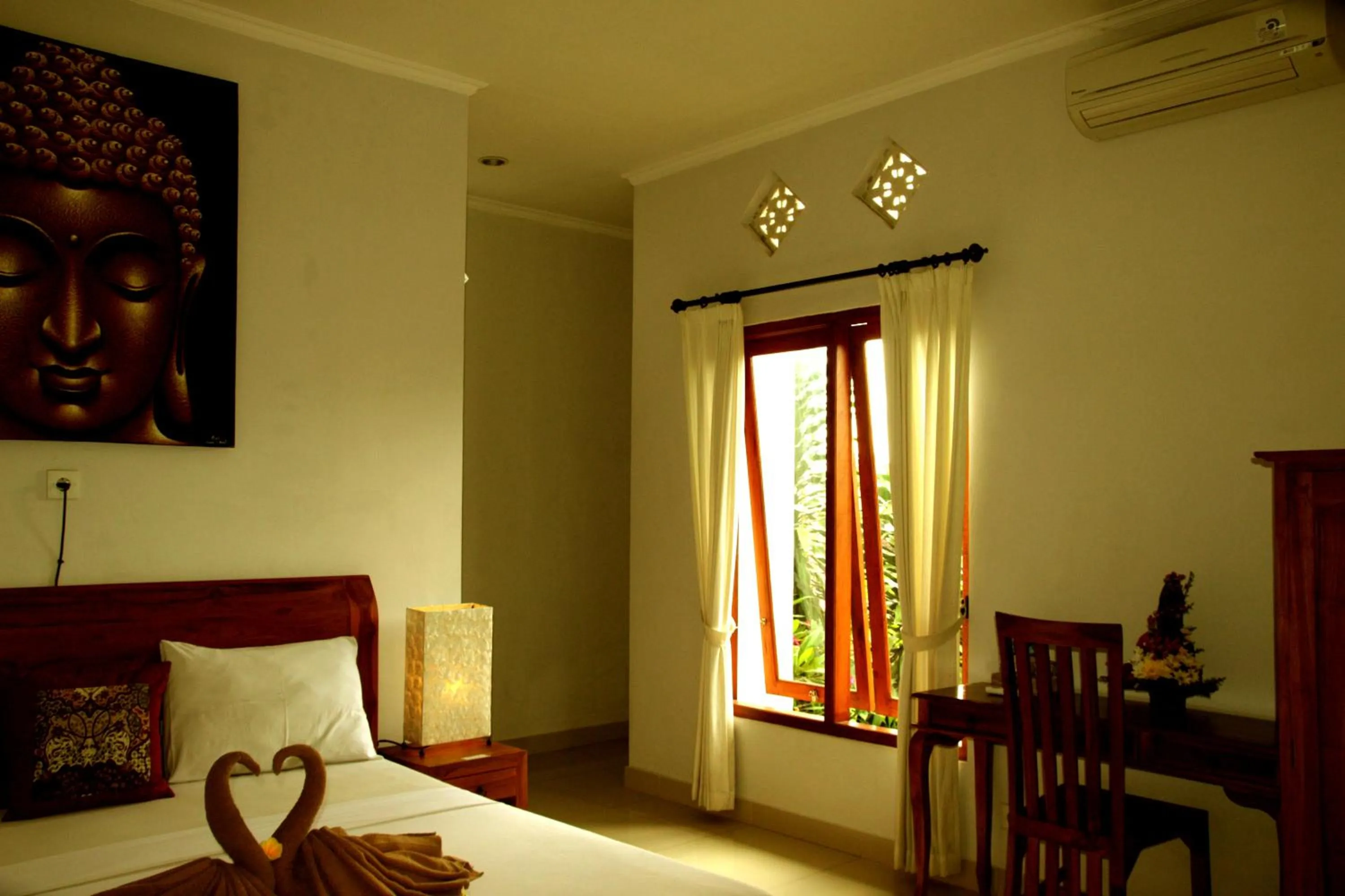Bed in Suryadina Guest House