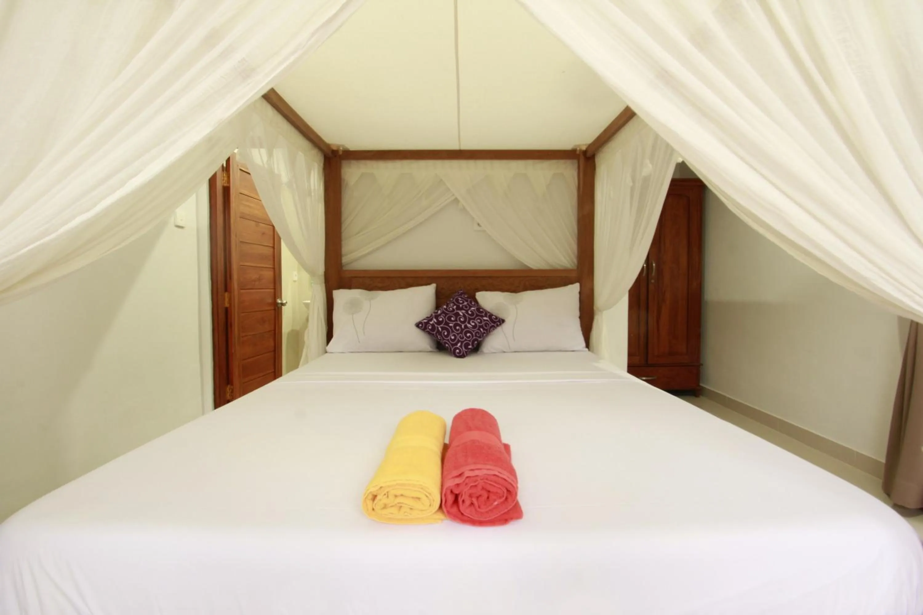 Photo of the whole room, Bed in Suryadina Guest House