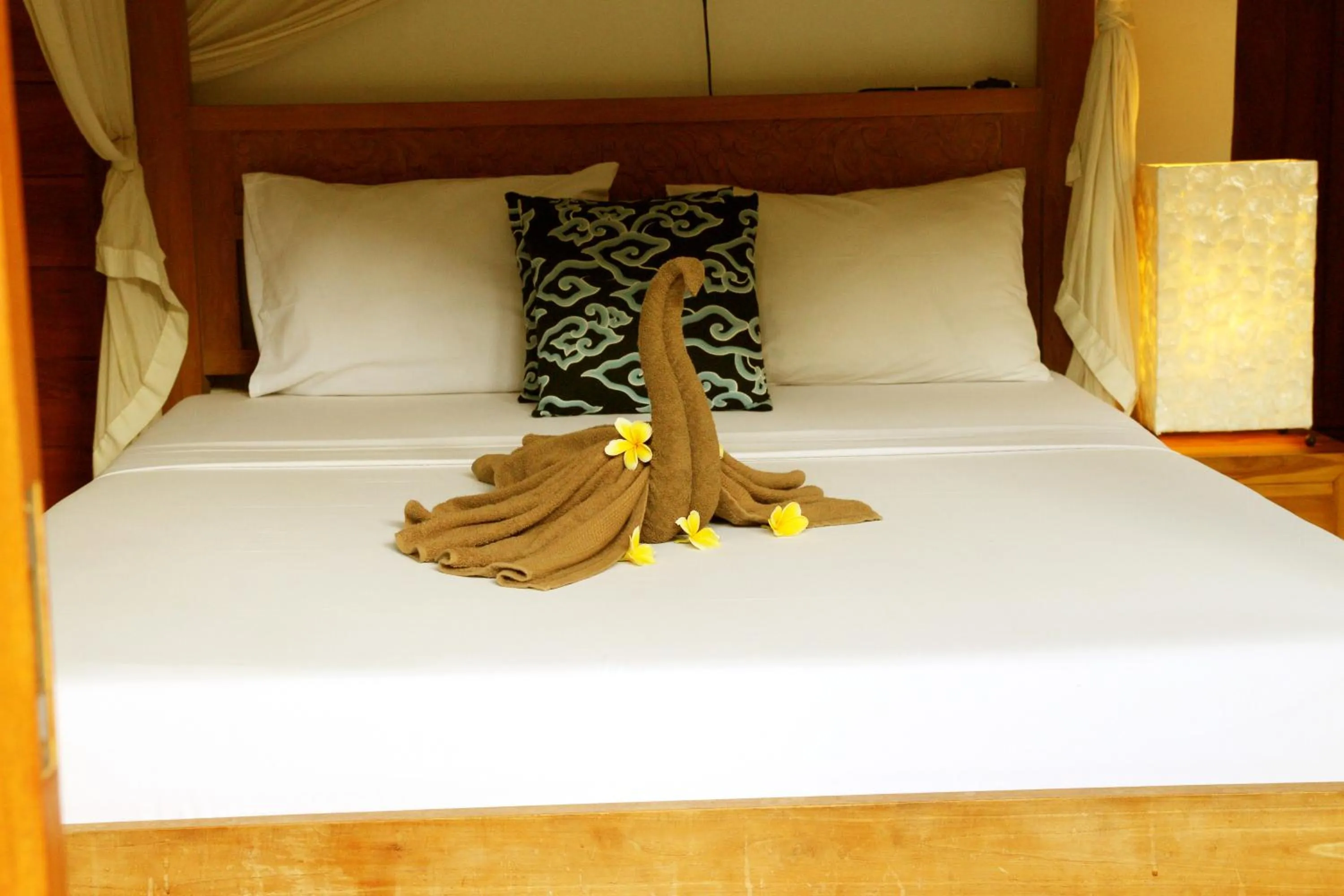 Bed in Suryadina Guest House