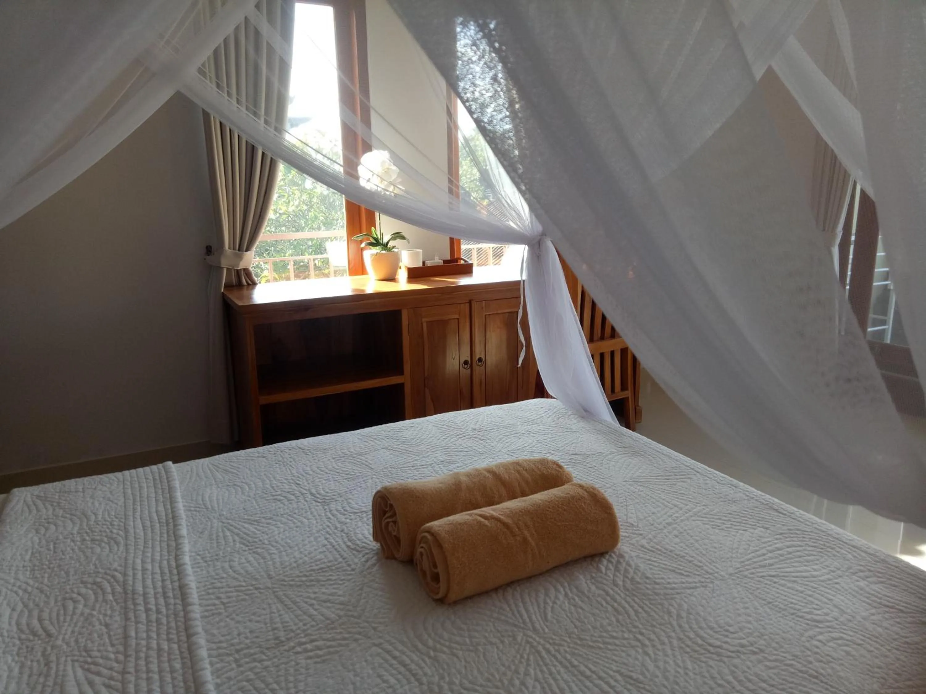 Bed in Suryadina Guest House