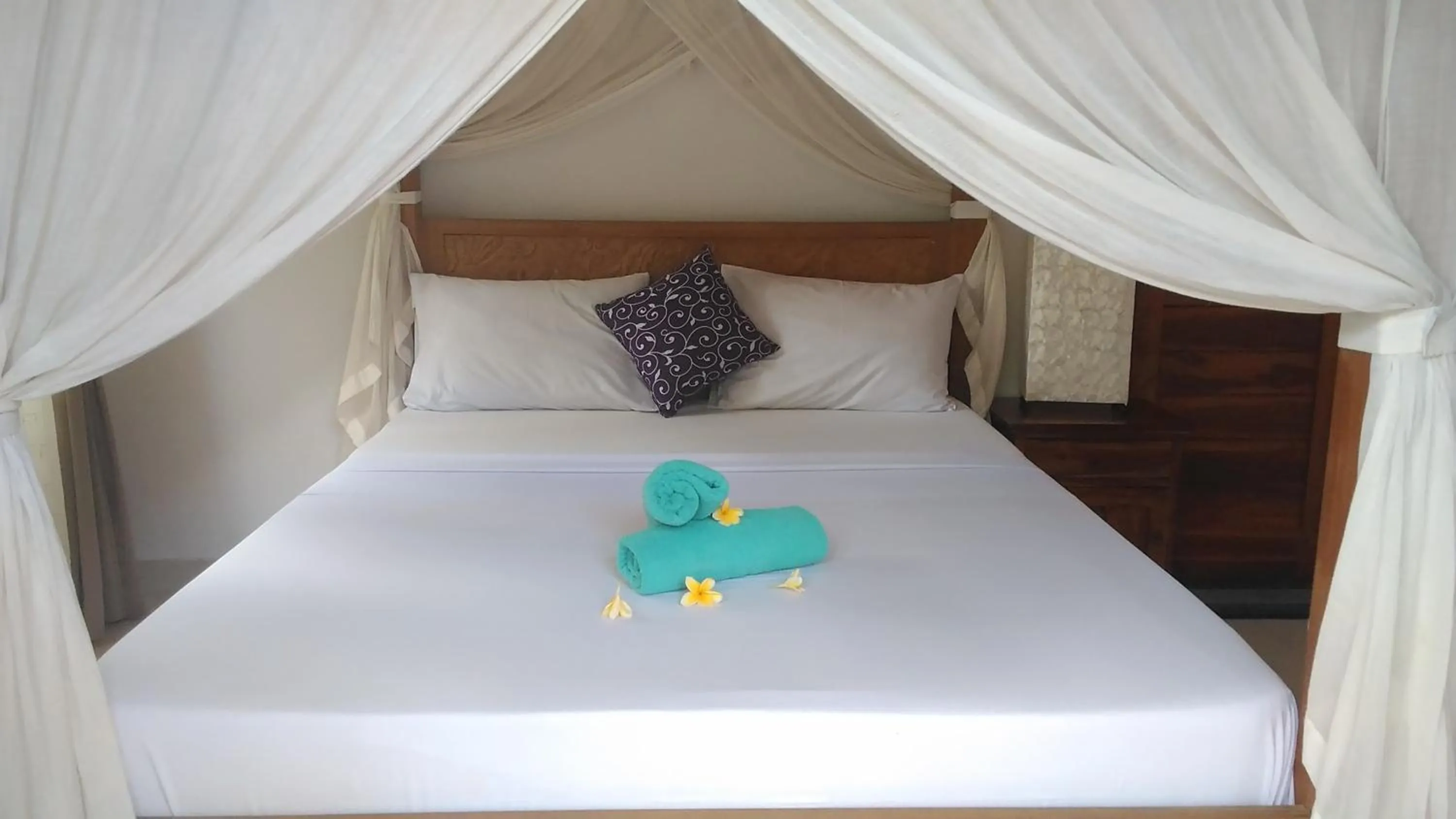 Bed in Suryadina Guest House