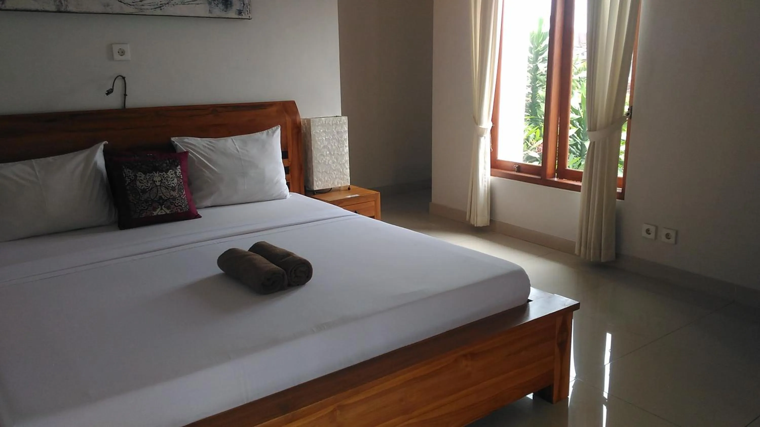 Photo of the whole room, Bed in Suryadina Guest House