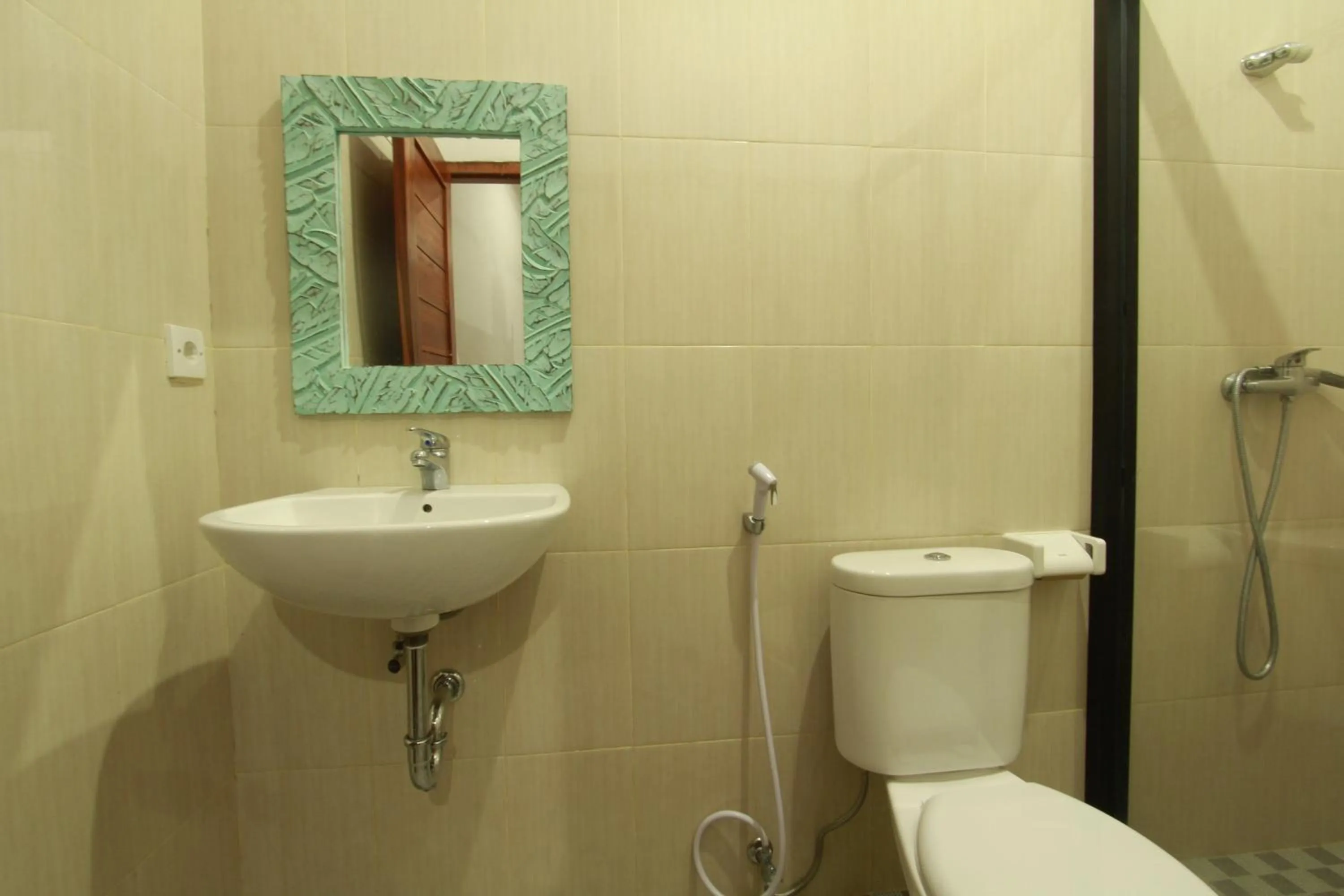 Bathroom in Suryadina Guest House