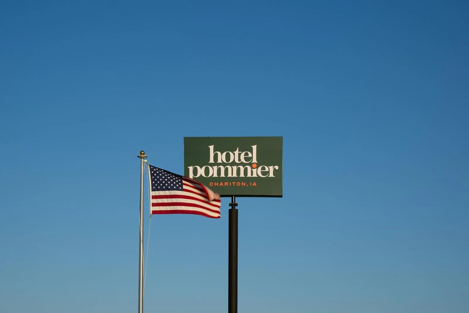 Property logo or sign in Hotel Pommier Chariton