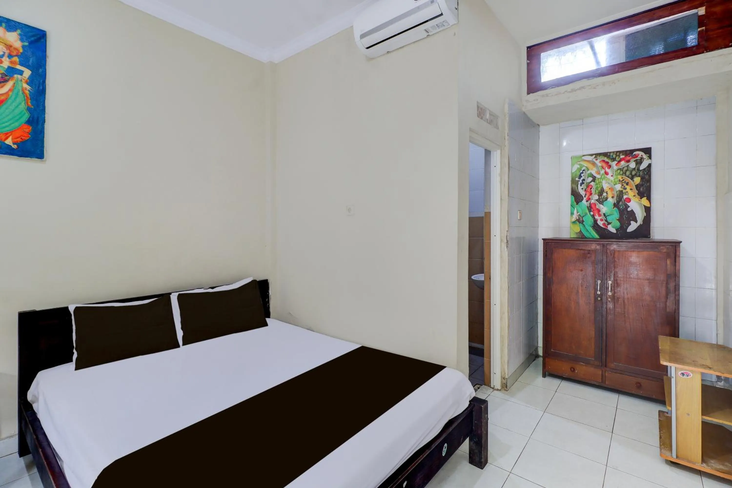 Photo of the whole room, Bed in Collection O Budget Door Legian Inn @Poppies Road