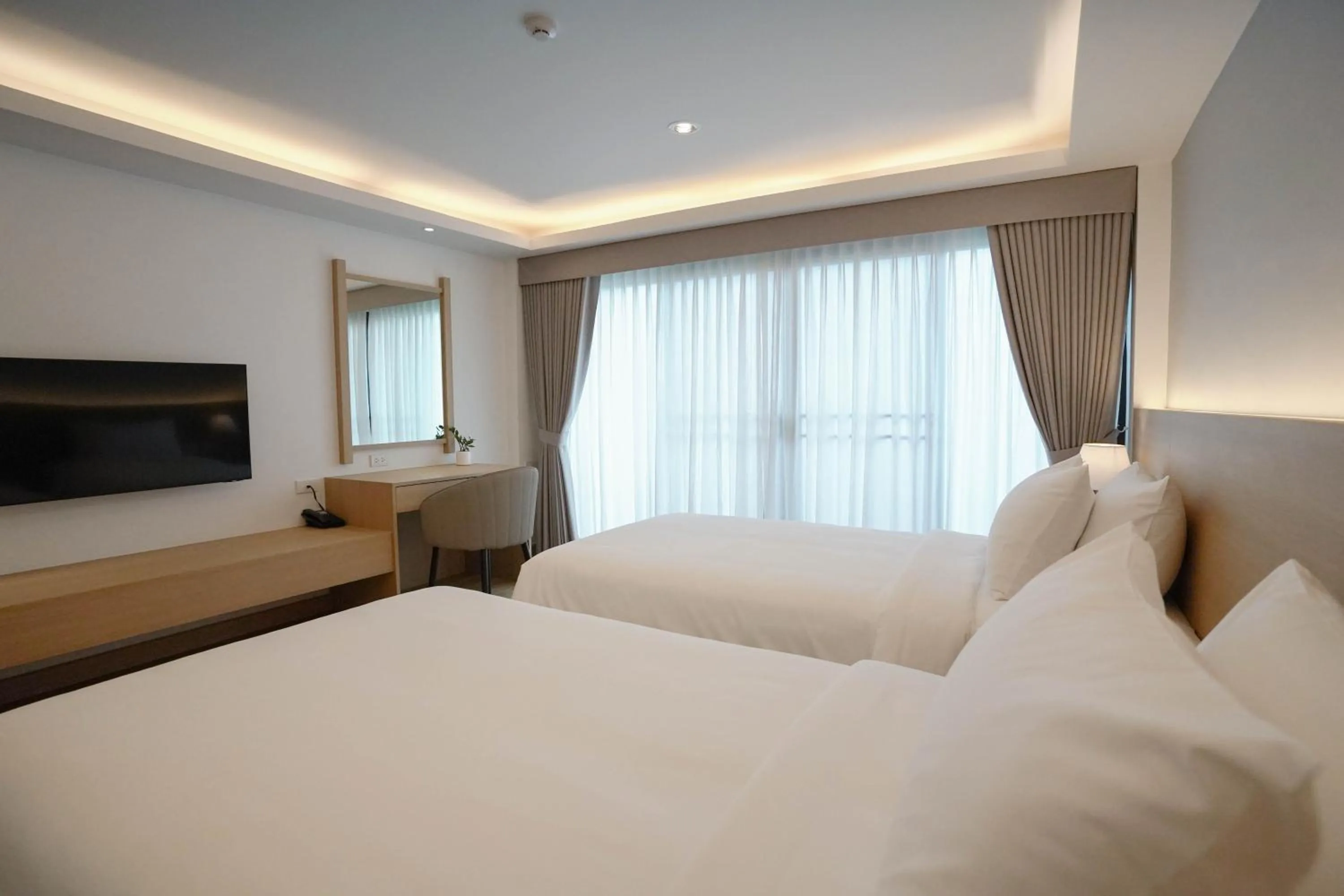 Bed in The Kite Hotel Bangsaen by Koko