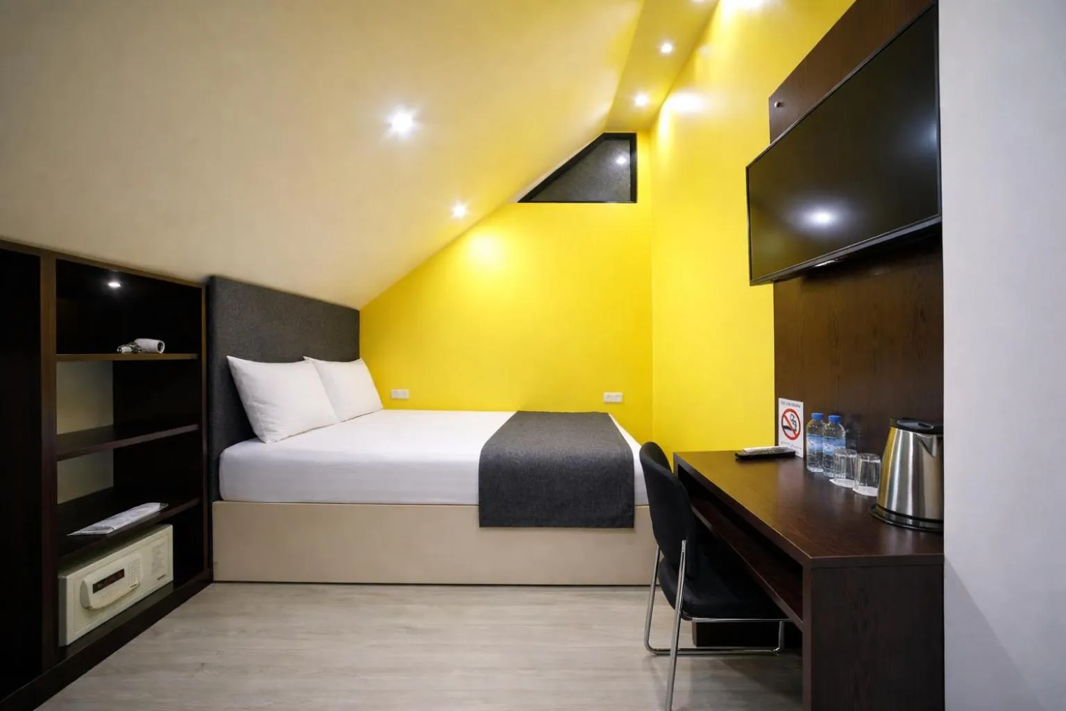 Bed in Elysium Gallery Hotel