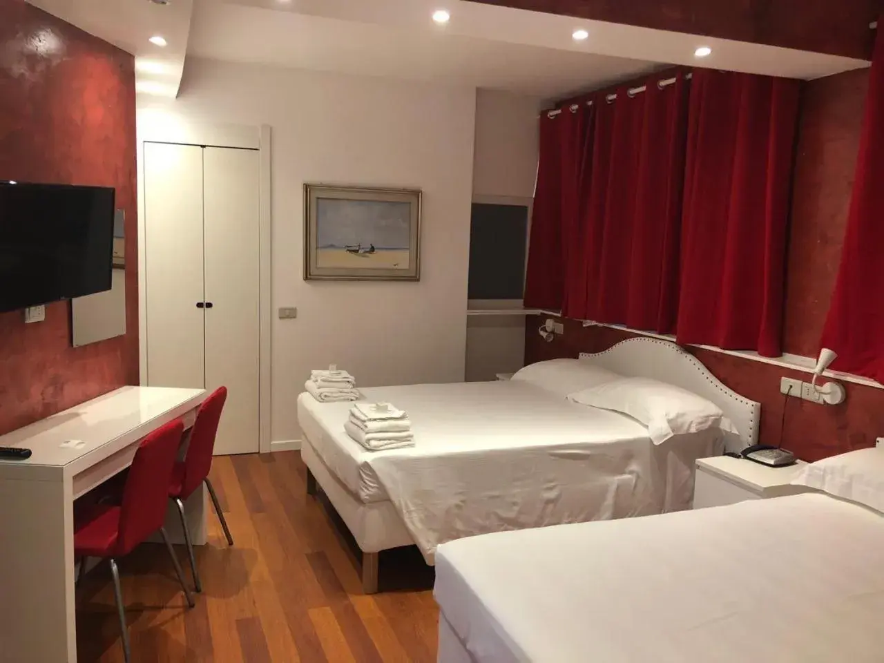 Classic Quadruple Room in Hotel Malpensafiera Classic Quadruple Room in Hotel Malpensafiera