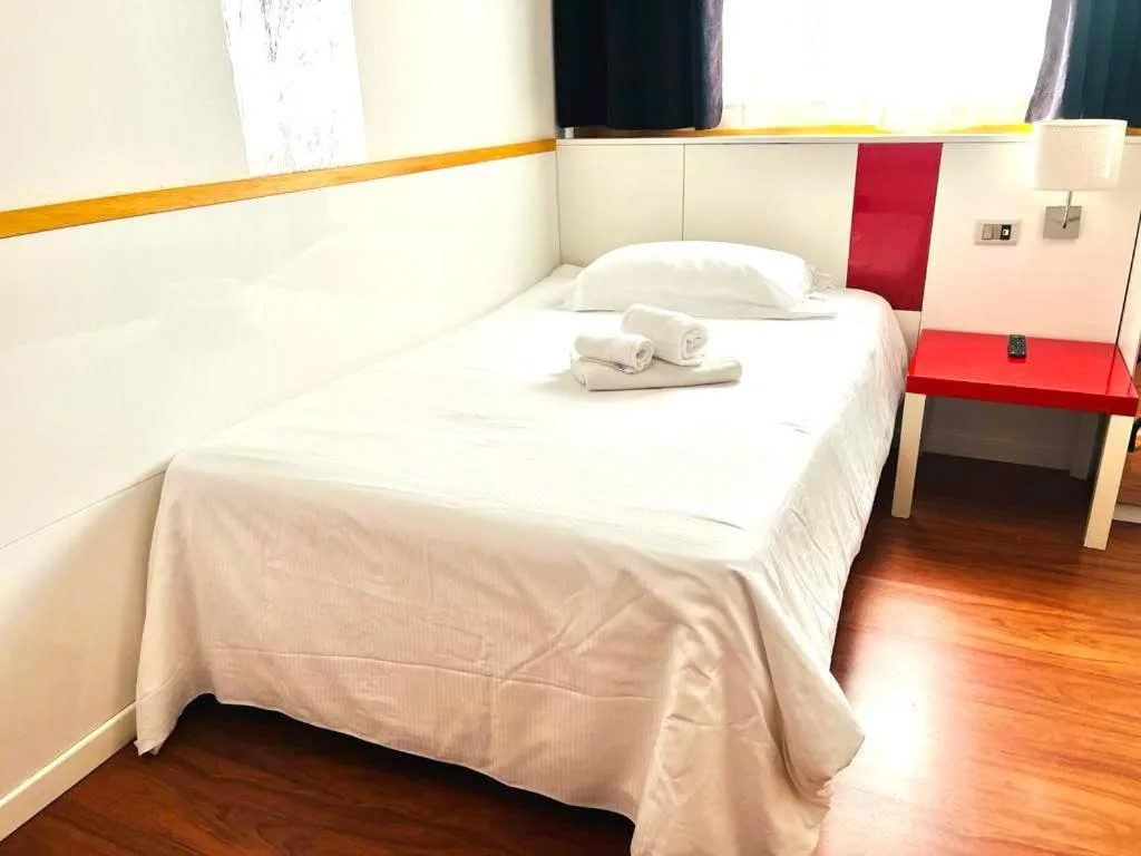 Bed in Hotel Malpensafiera