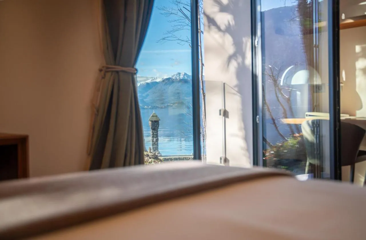 Photo of the whole room, Bed in Villa Lario Resort Mandello