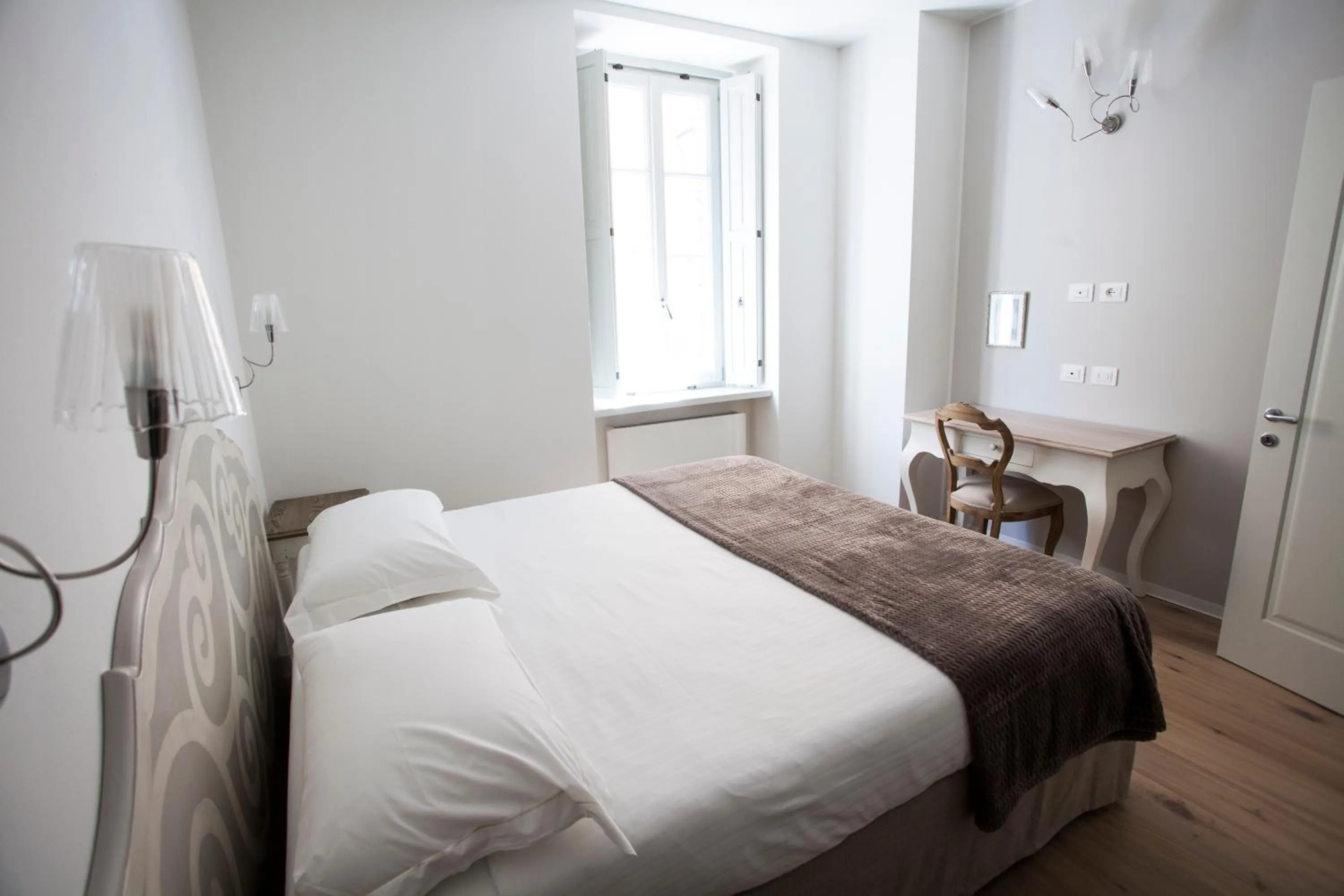 Bed in Villa Italia Luxury Suites and Apartments