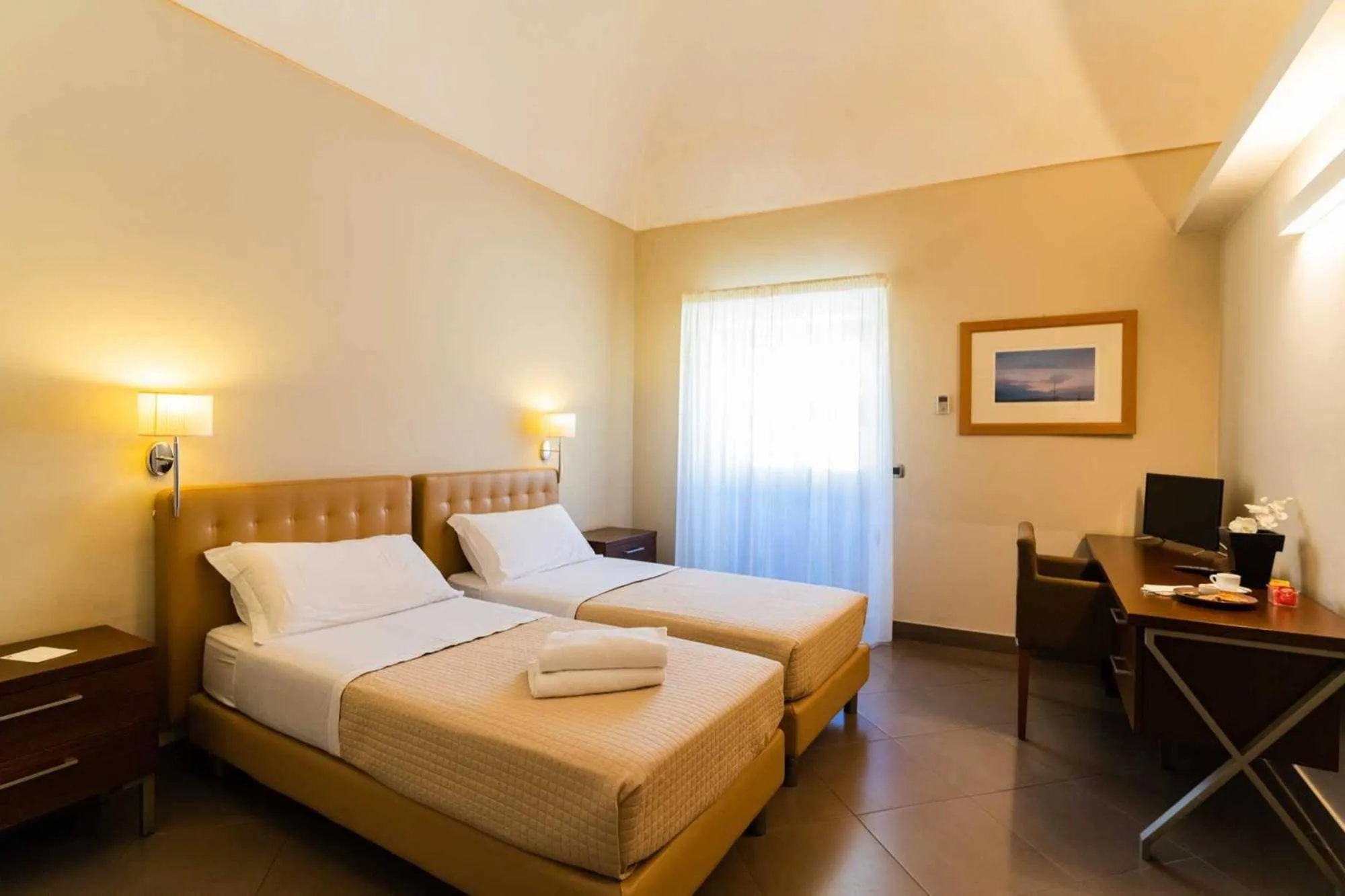 Bed in Le Magnolie Hotel