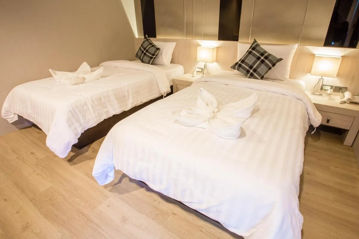 Bed in Kesorn Boutique Hotel