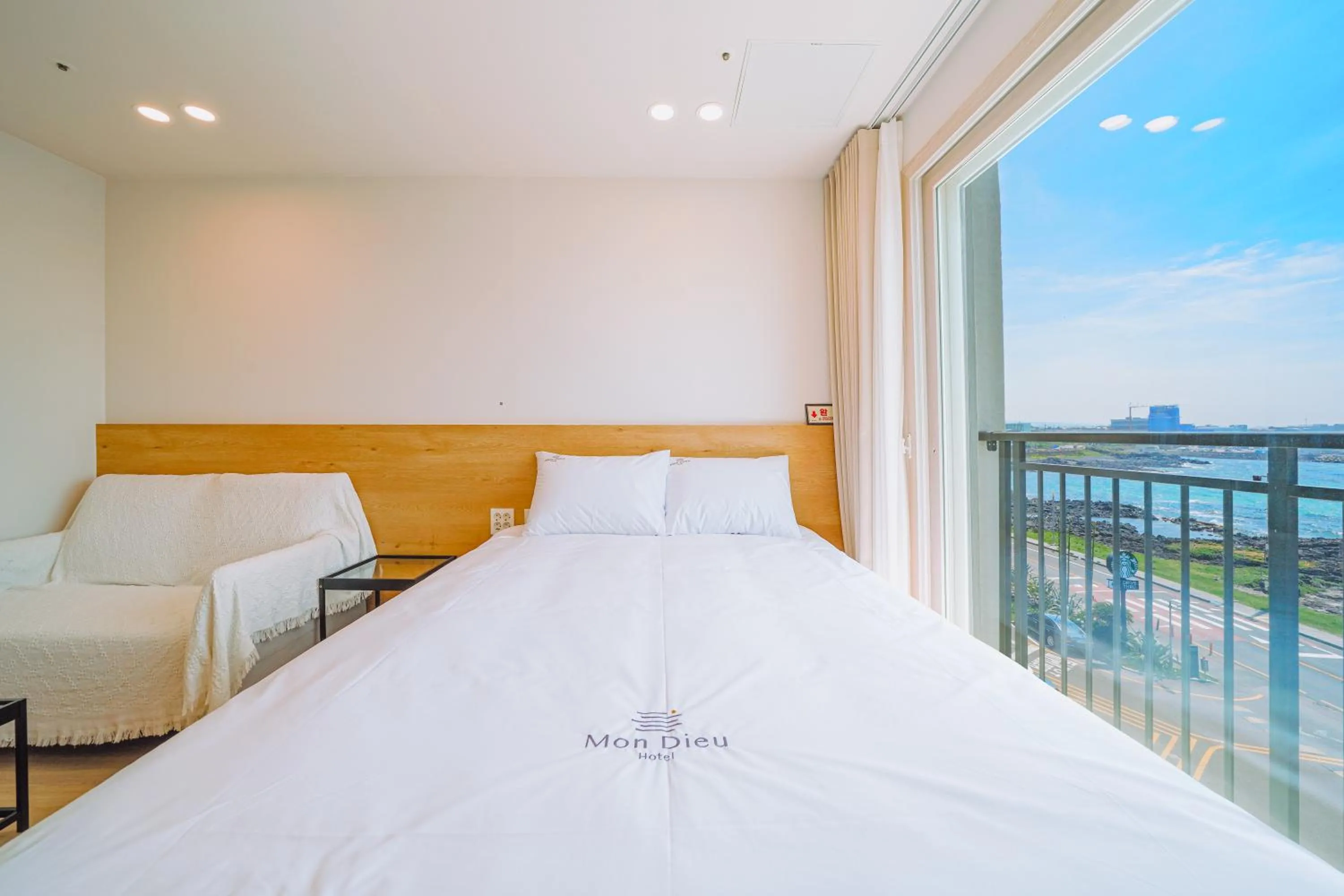 Bed in Jeju Mon Dieu Hotel