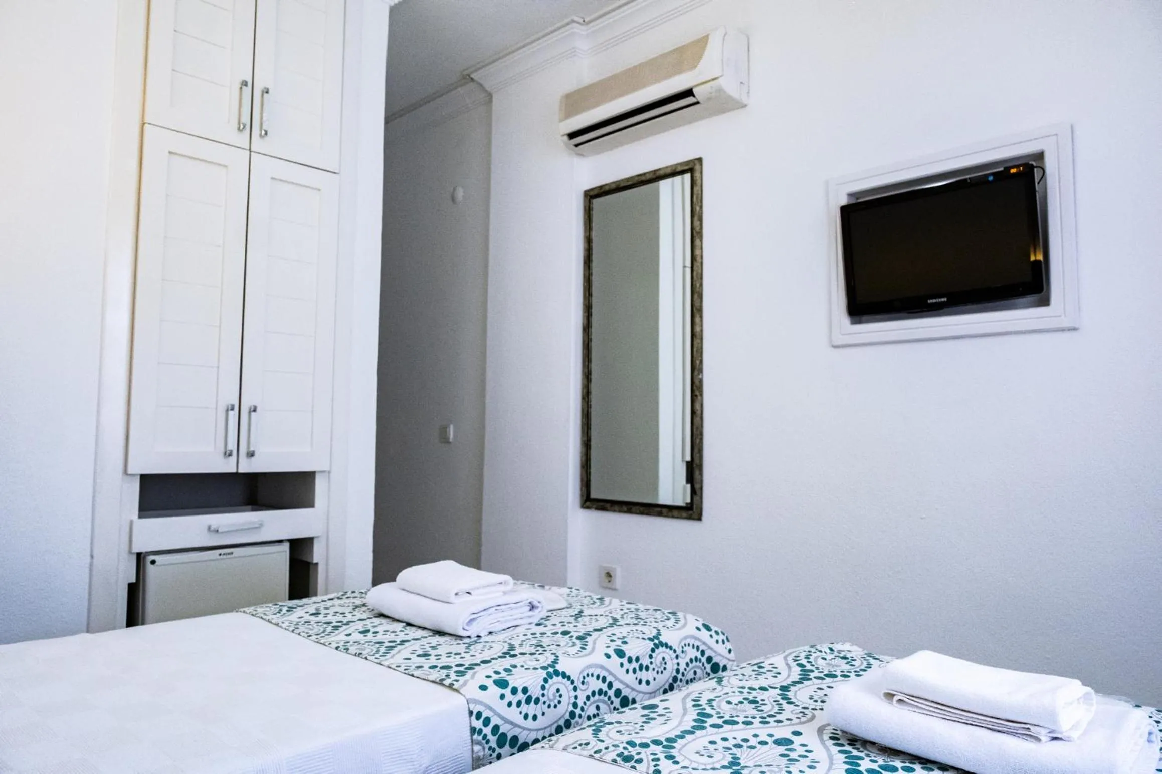 Bedroom, Bed in Mauna Hotel