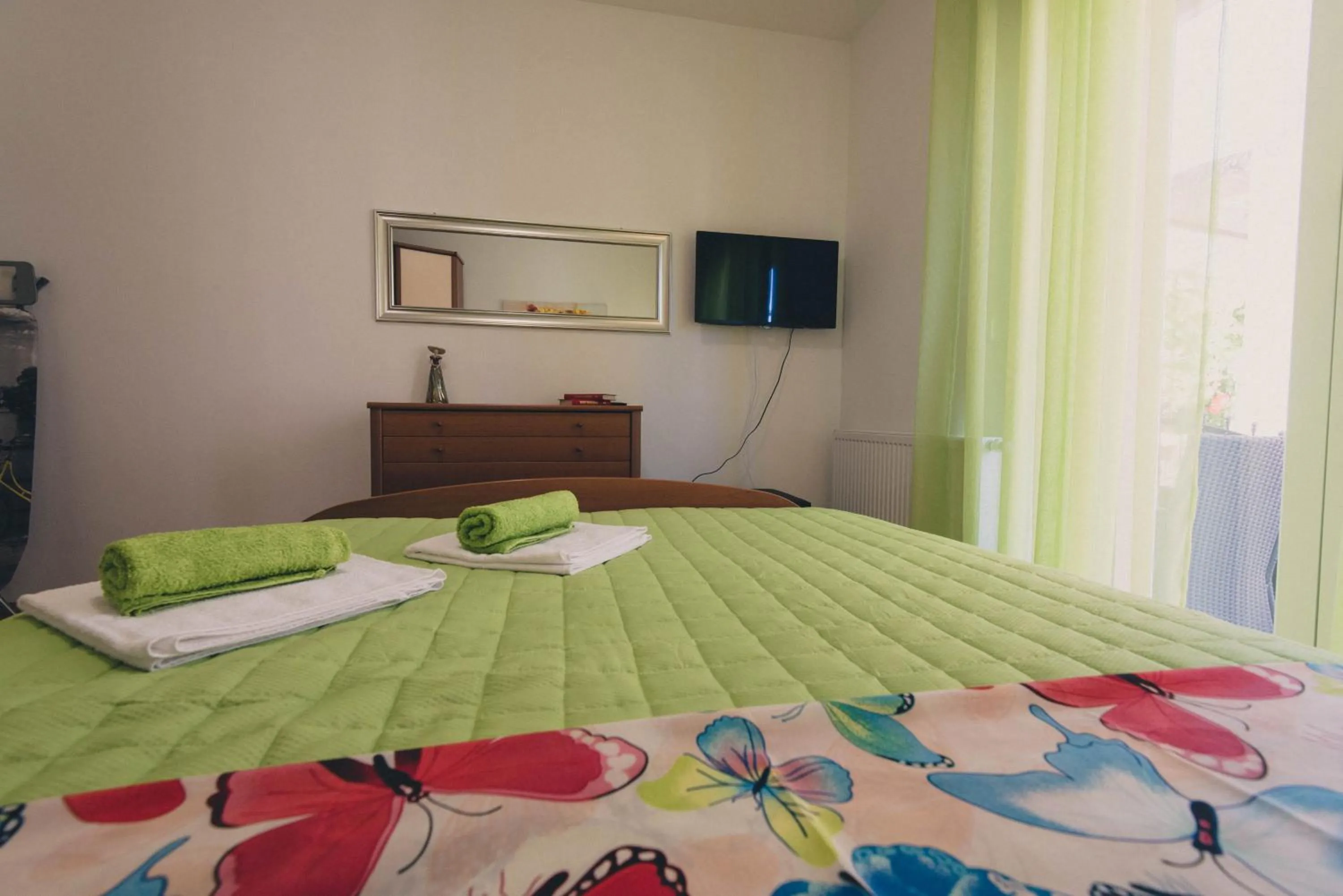 Bedroom, Bed in Apartments Sunny Garden