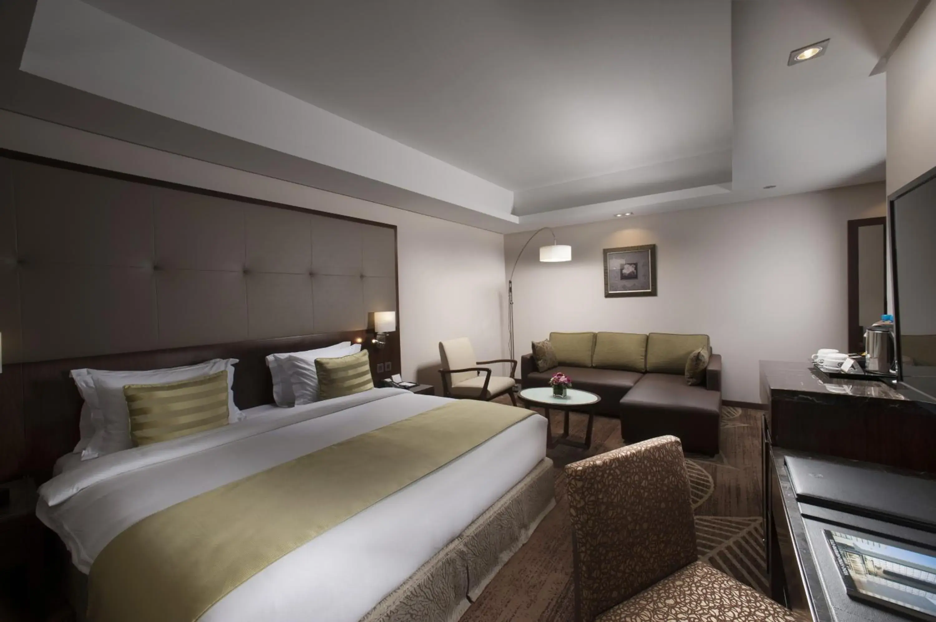 Seating area, Bed in Ramee Rose Hotel Seating area, Bed in Ramee Rose Hotel