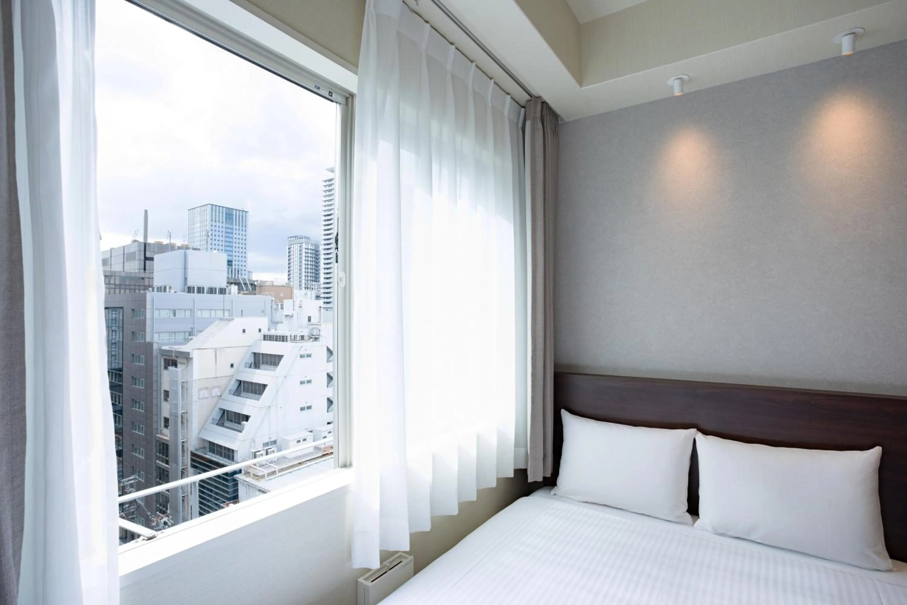 Photo of the whole room, Bed in Far East Village Hotel Osaka, Honmachi